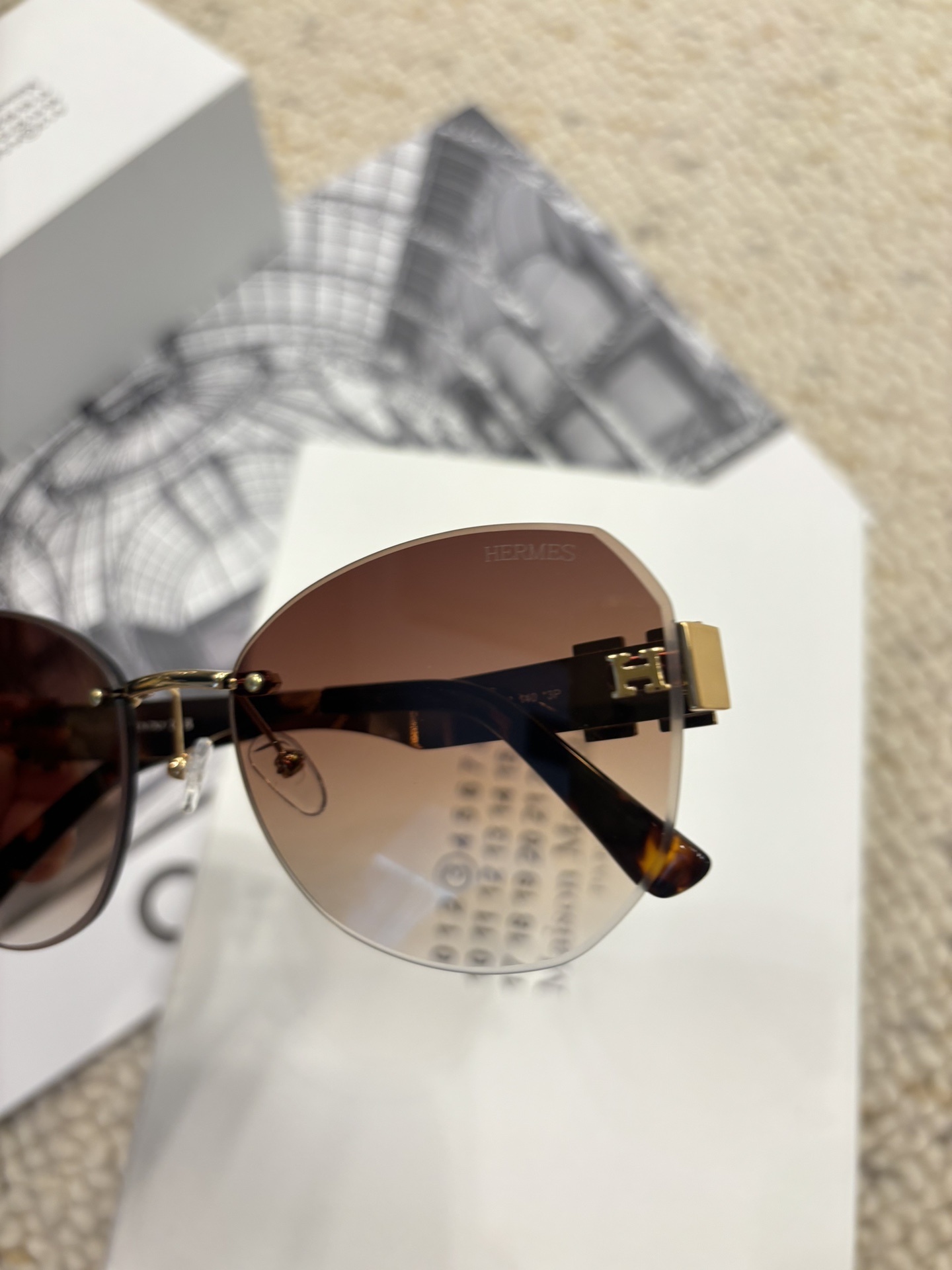 Hermès Rimless Butterfly Sunglasses – Brown Gradient with Gold H
