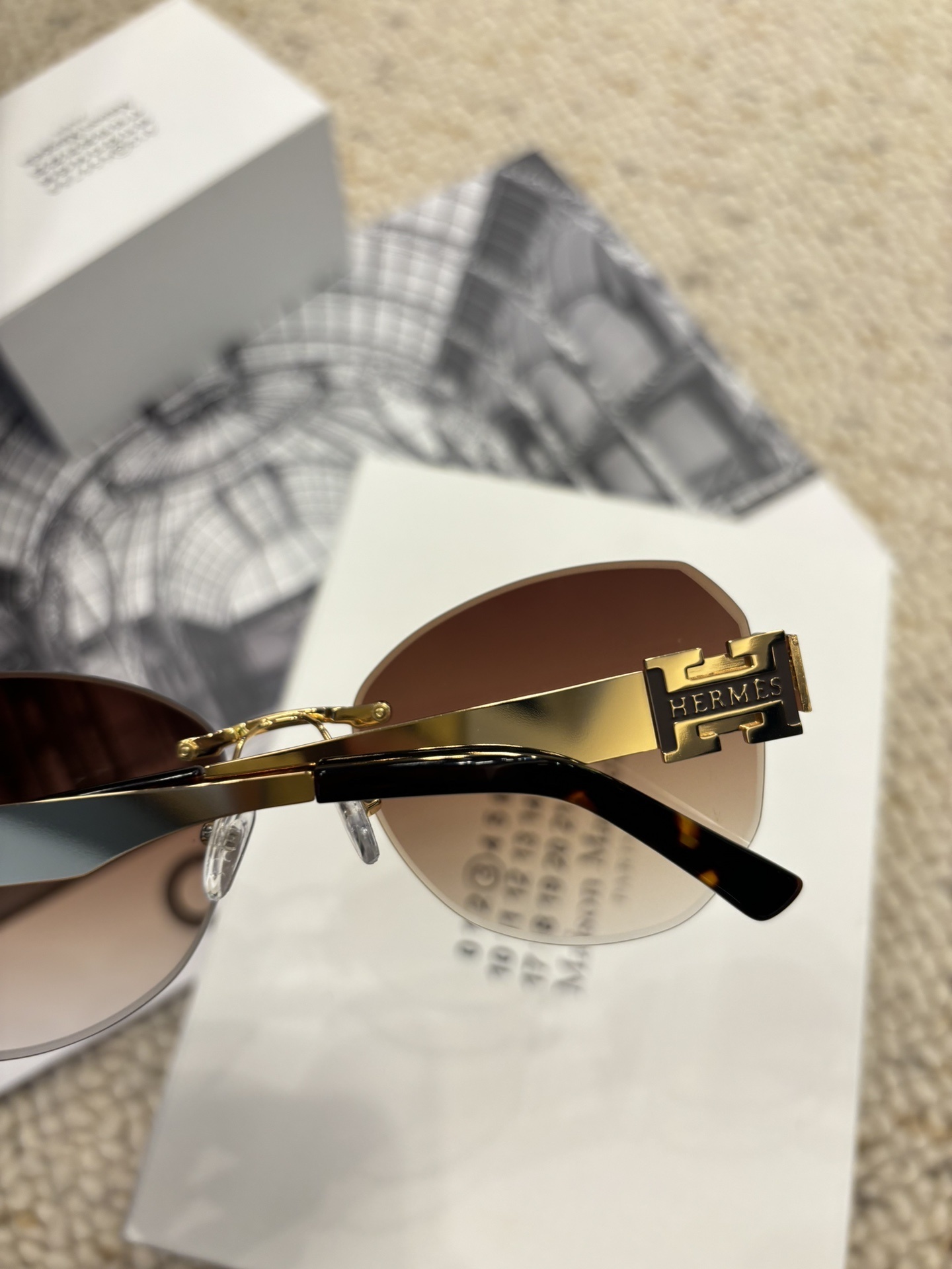 Hermès Rimless Butterfly Sunglasses – Brown Gradient with Gold H