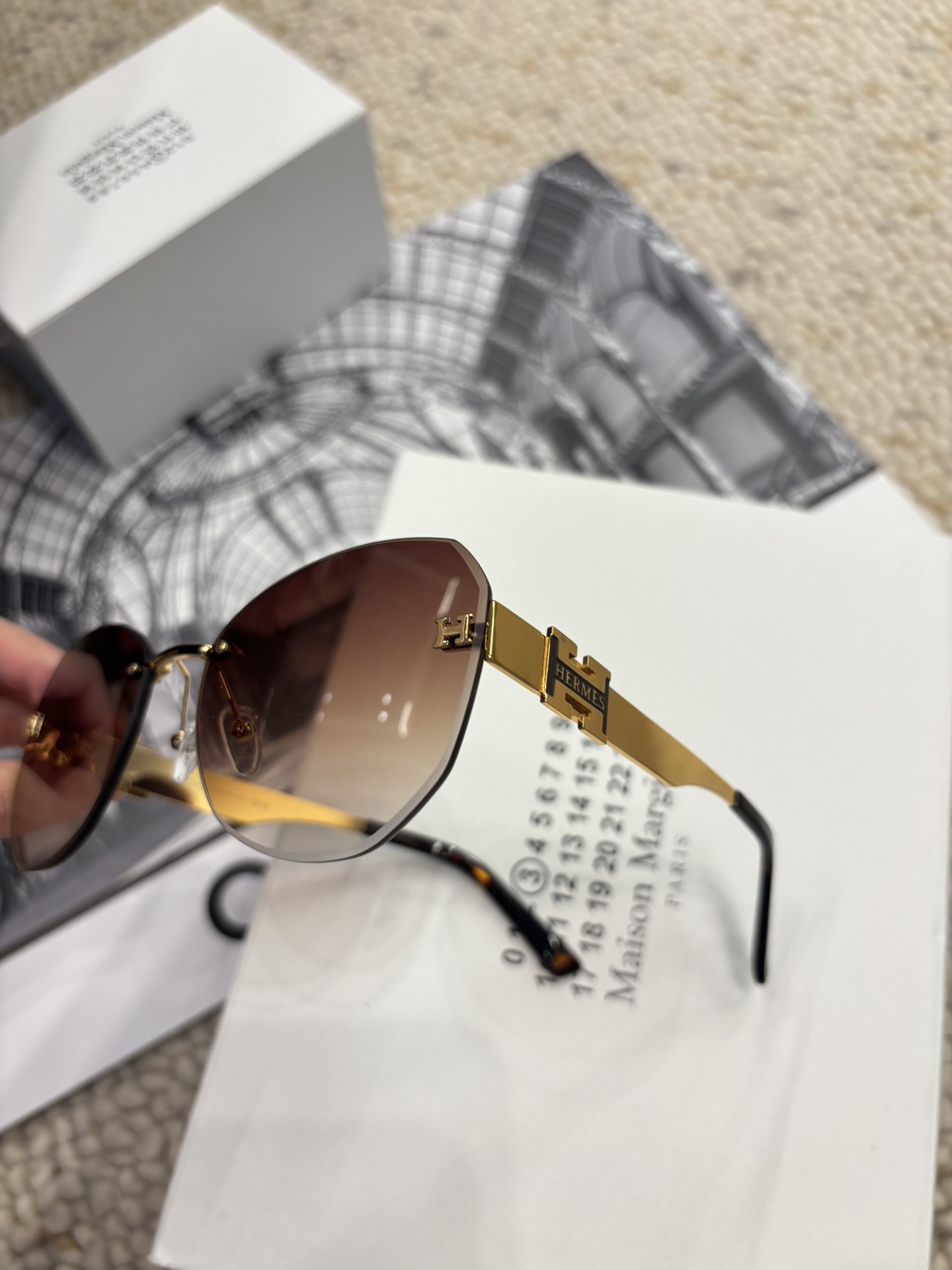 Hermès Rimless Butterfly Sunglasses – Brown Gradient with Gold H