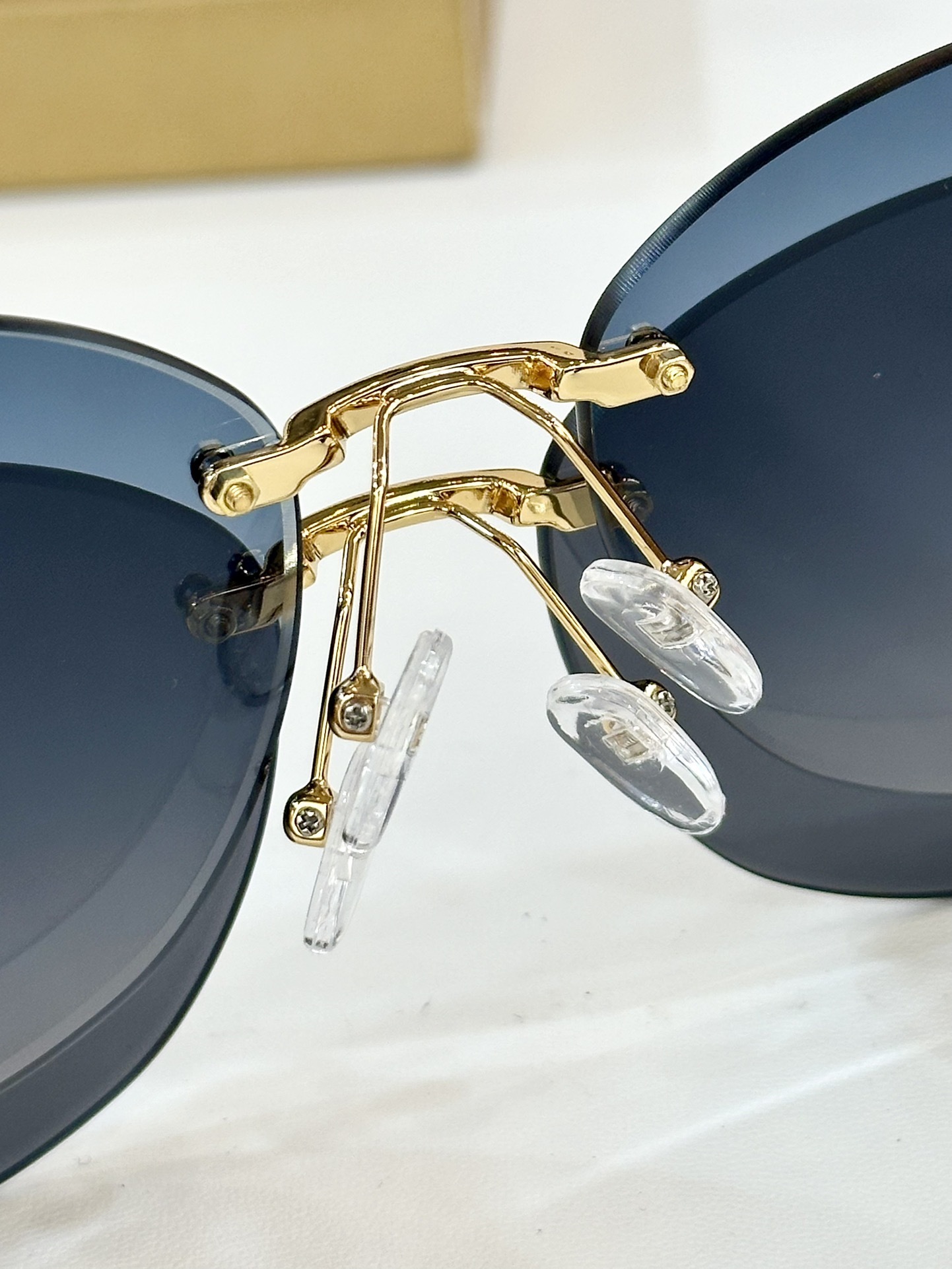 Hermes Luxury Rimless Butterfly Sunglasses – Gold H Logo & Gradient