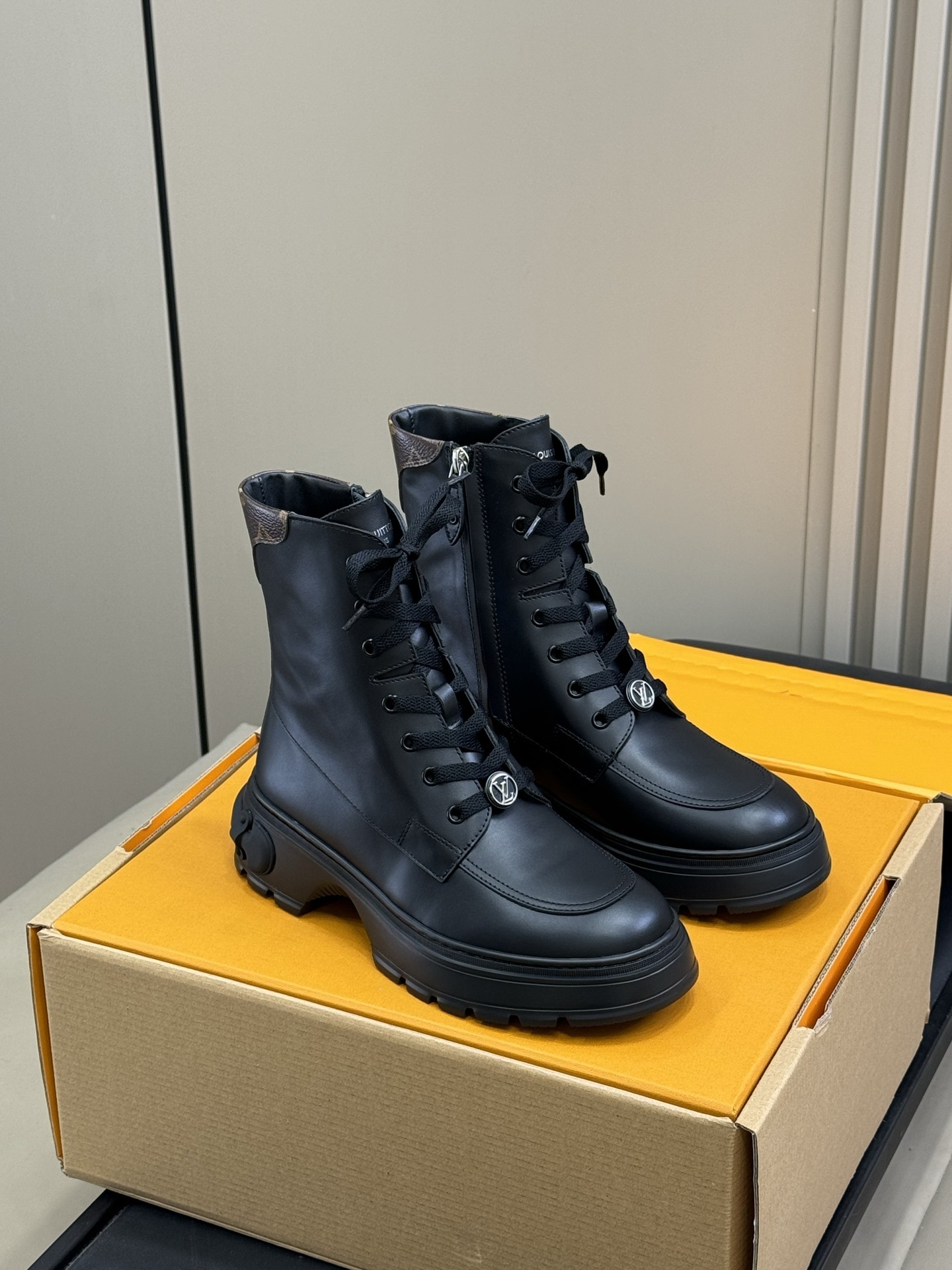 Luxury Black Leather Combat Boots with Monogram Trim Detail