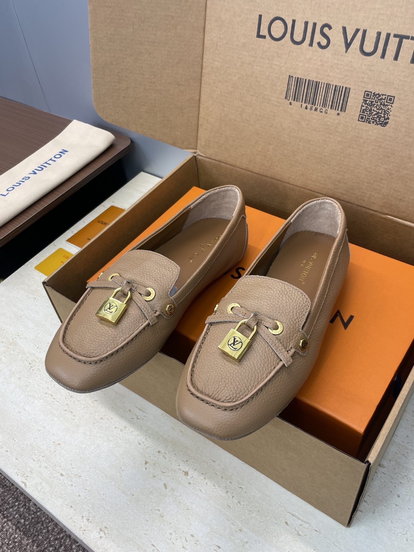 Louis Vuitton Beige Leather Loafers with Gold Padlock Detail