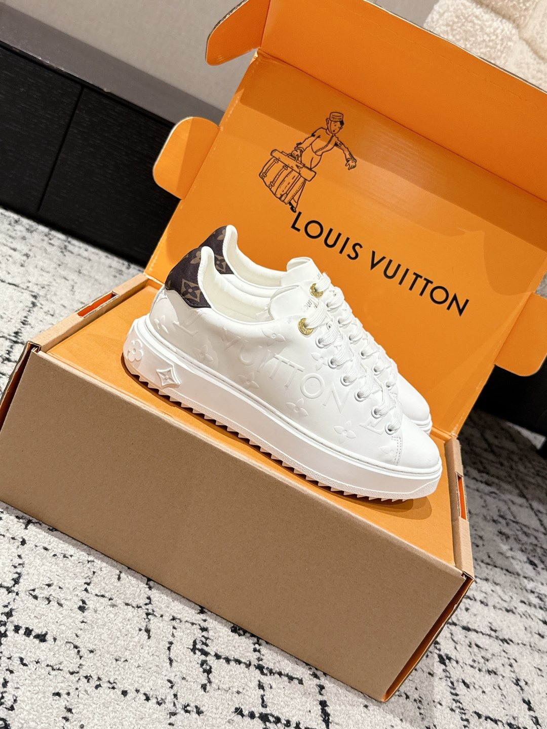 Louis Vuitton Women's White Monogram Embossed Leather Sneakers