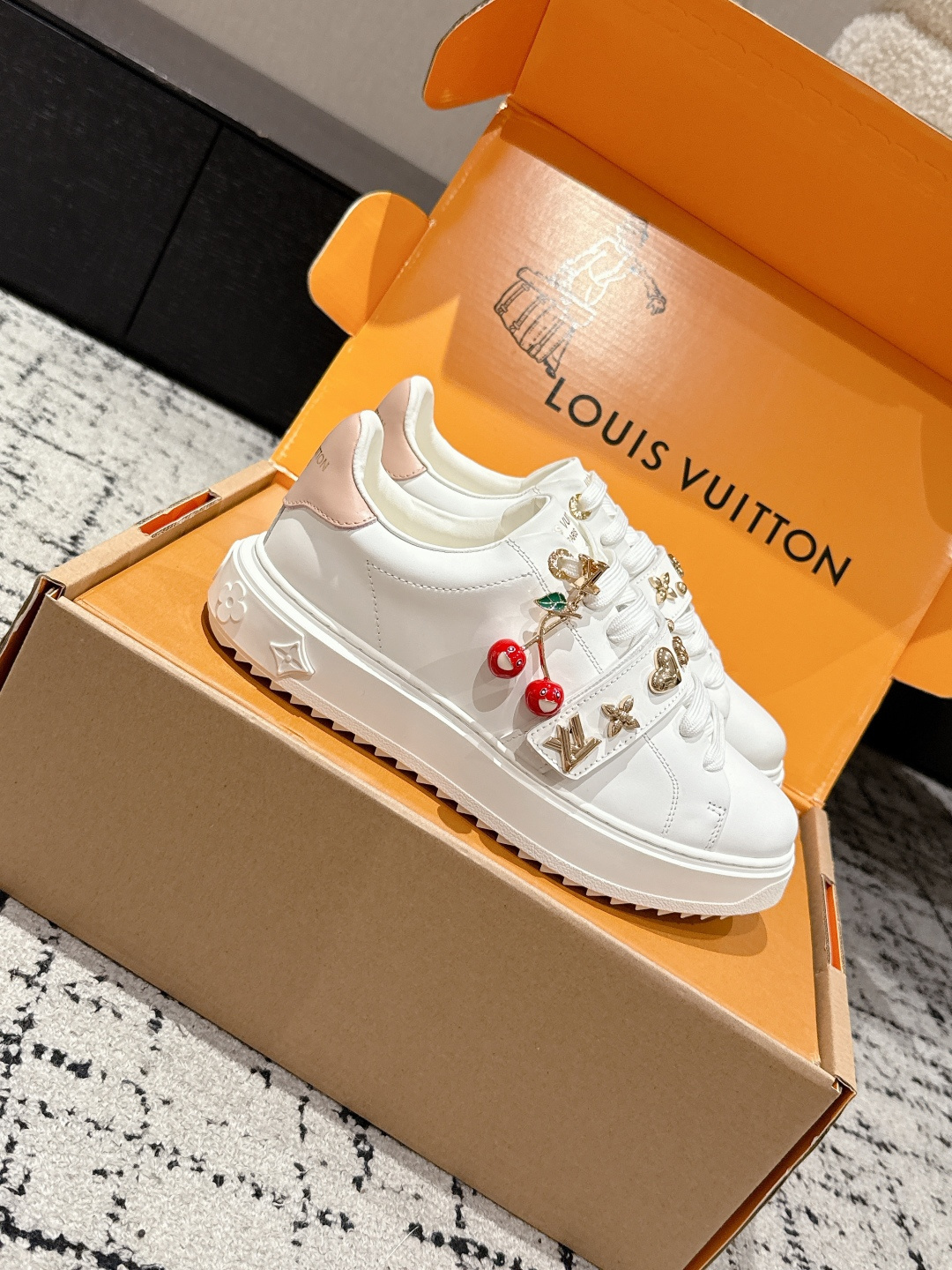 Louis Vuitton White Leather Sneakers with Iconic Gold Charms