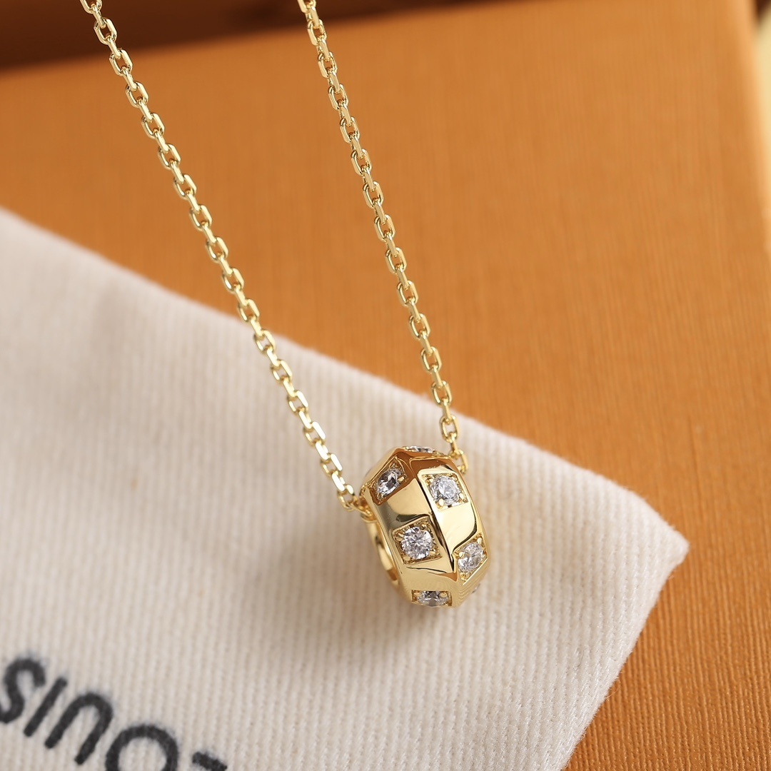 Louis Vuitton Gold Cylinder Diamond Pendant – Elegant Sparkle