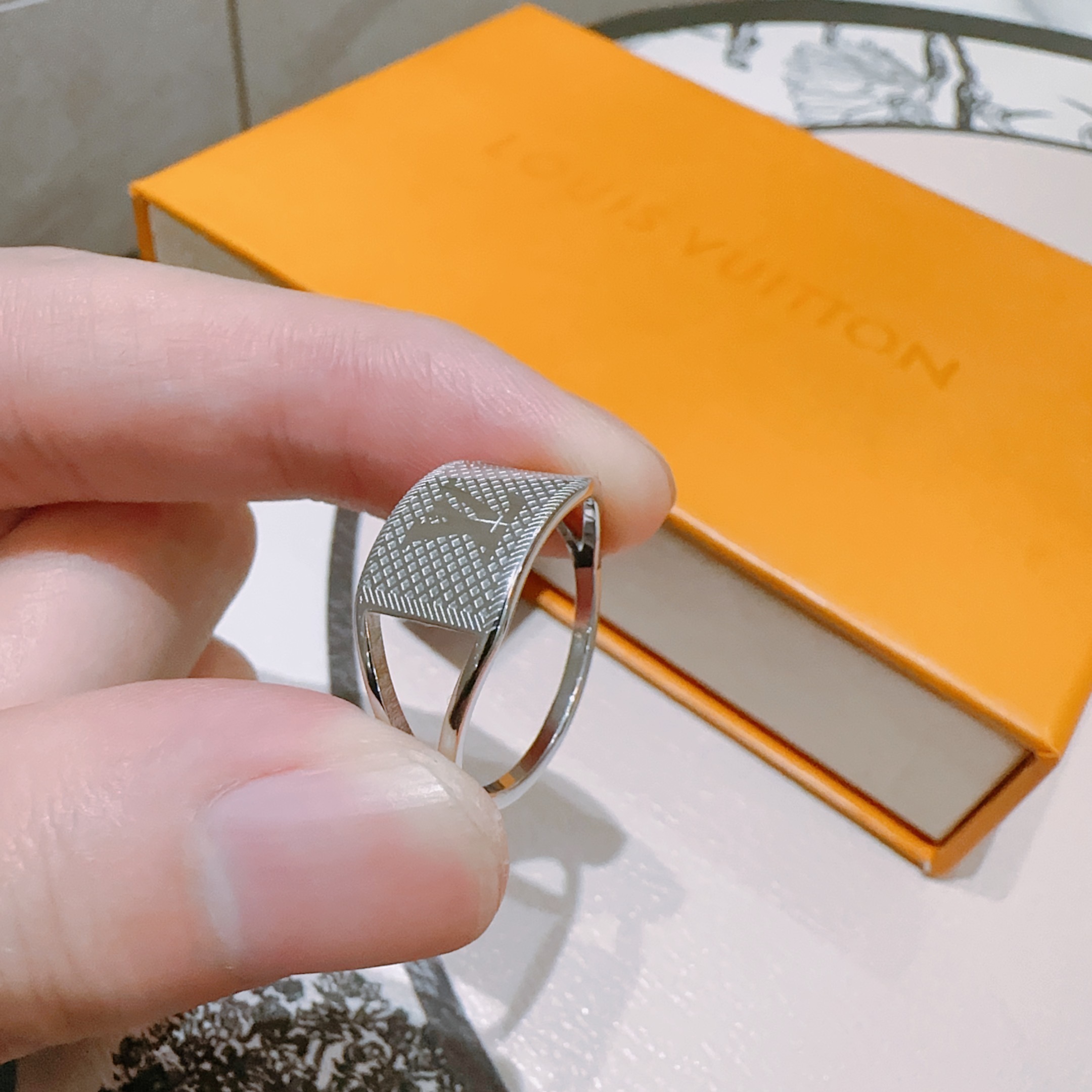 Louis Vuitton Silver LV Stamp Ring – Textured Luxury