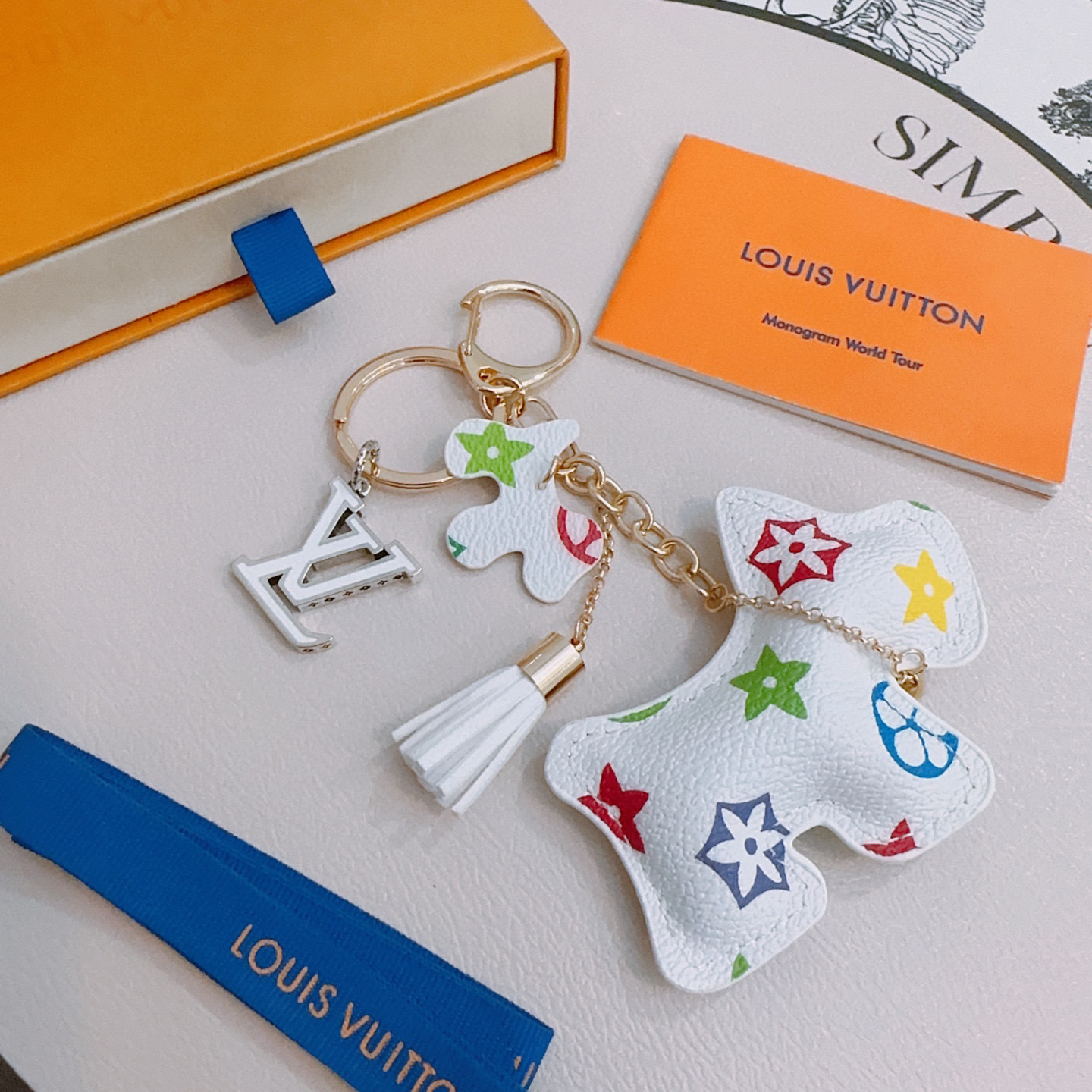 LV White Leather Dog Charm Keychain – Multicolor Stars
