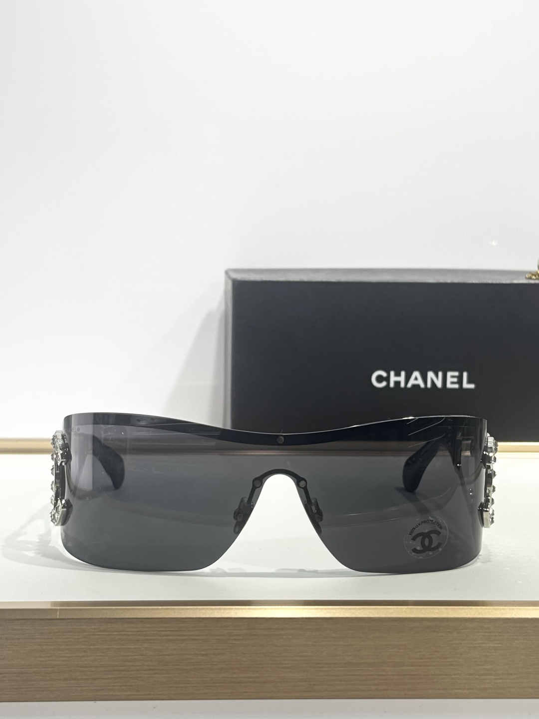 Chanel Shield Sunglasses with Crystal CC Logo Rimless Design