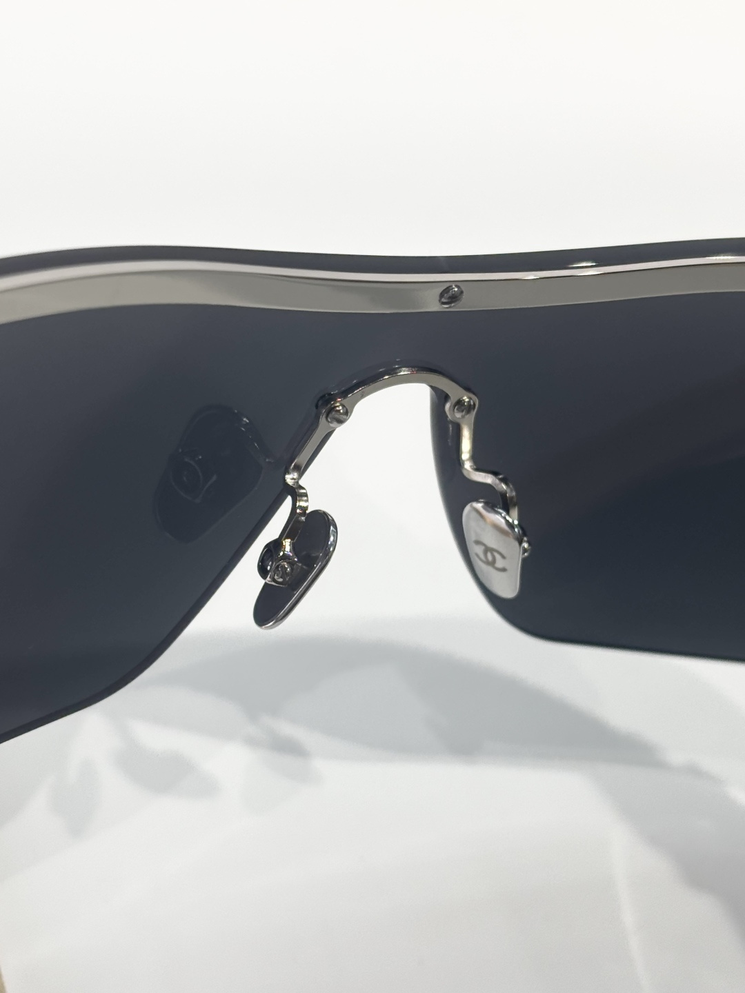 Chanel Shield Sunglasses with Crystal CC Logo Rimless Design