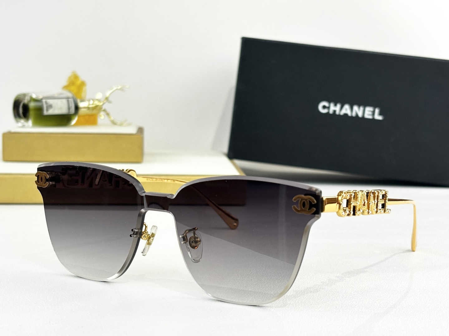 Chanel Butterfly Rimless Sunglasses – Luxury Gold Metal Logo