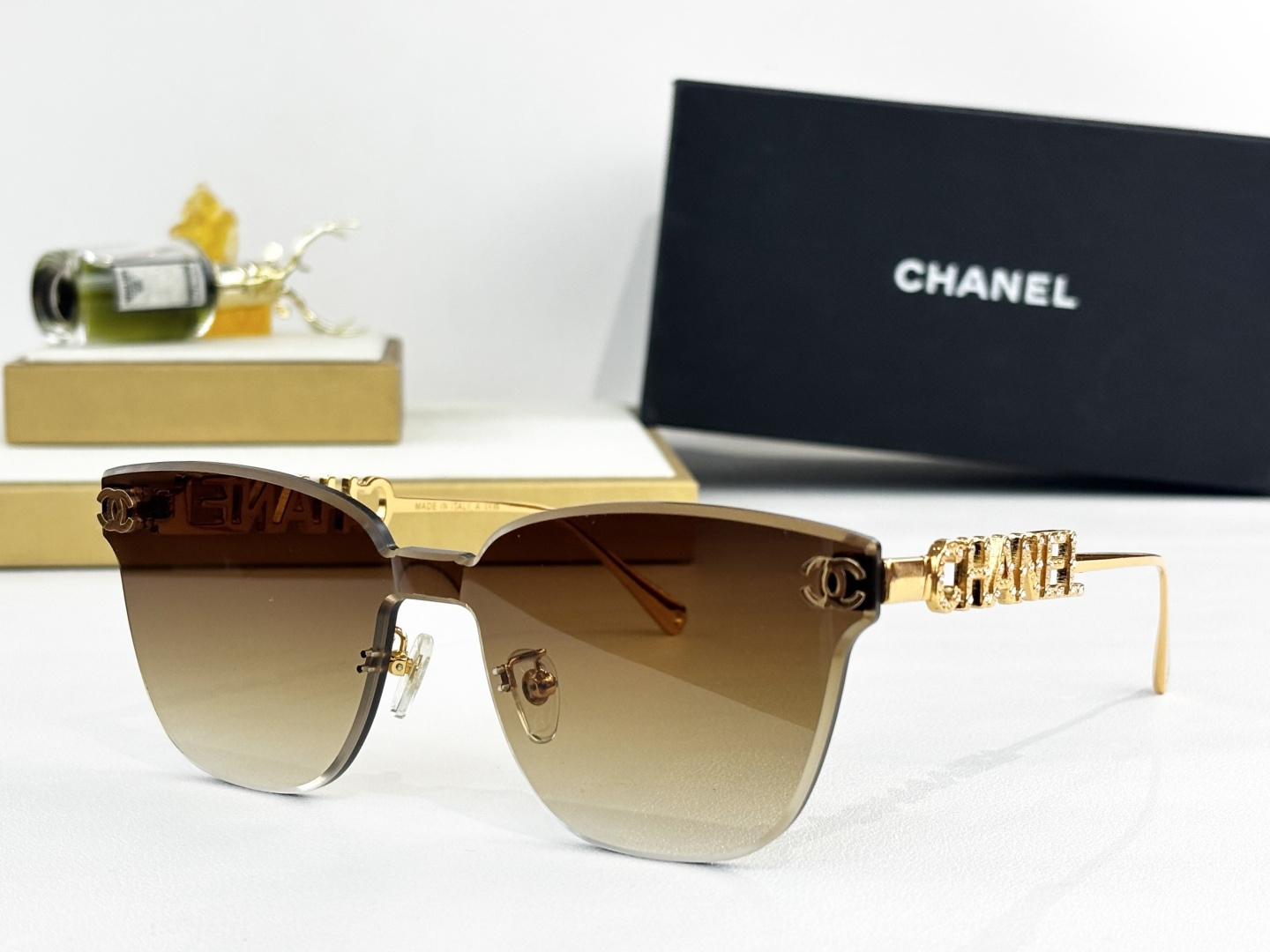 Chanel Butterfly Rimless Sunglasses – Luxury Gold Metal Logo