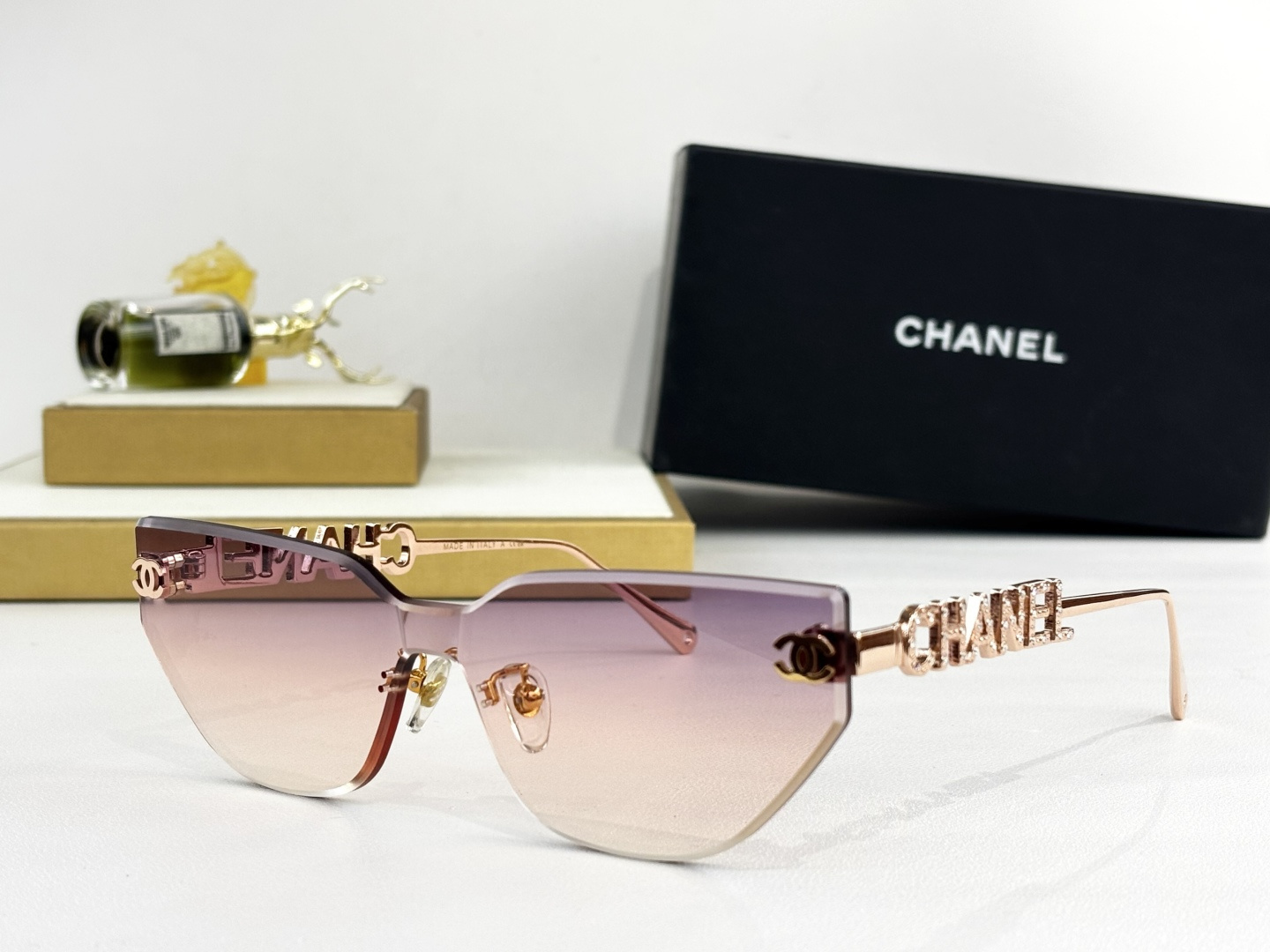 Chanel Luxury Rimless Cat-Eye Sunglasses – Gold Crystal Logo