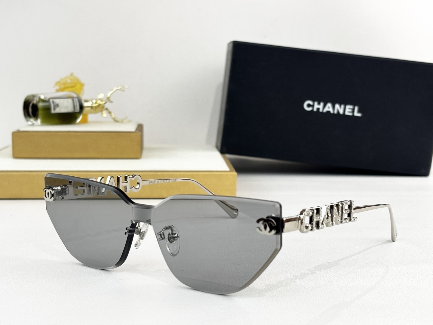 Chanel Luxury Rimless Cat-Eye Sunglasses – Gold Crystal Logo