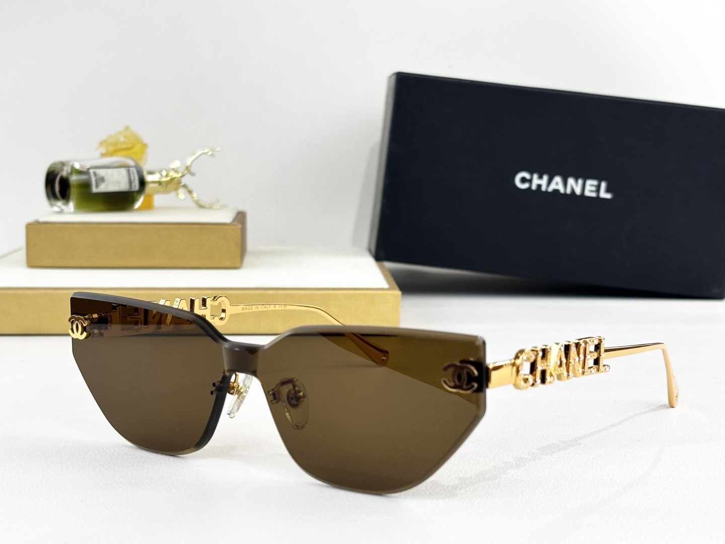 Chanel Luxury Rimless Cat-Eye Sunglasses – Gold Crystal Logo