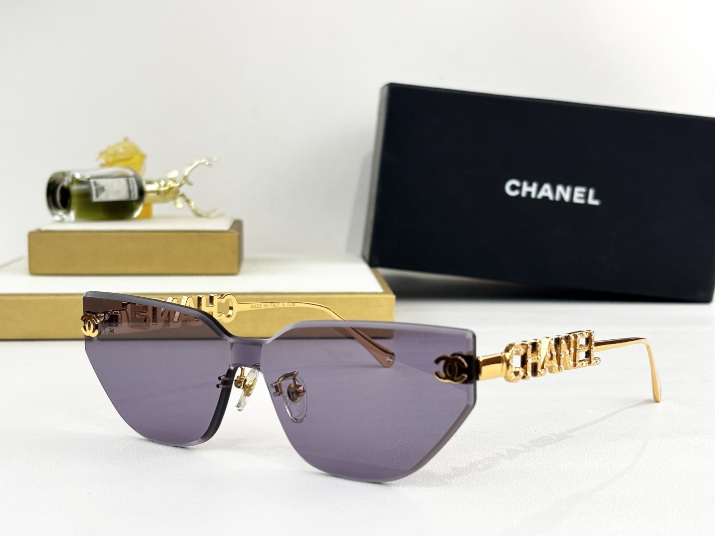 Chanel Luxury Rimless Cat-Eye Sunglasses – Gold Crystal Logo