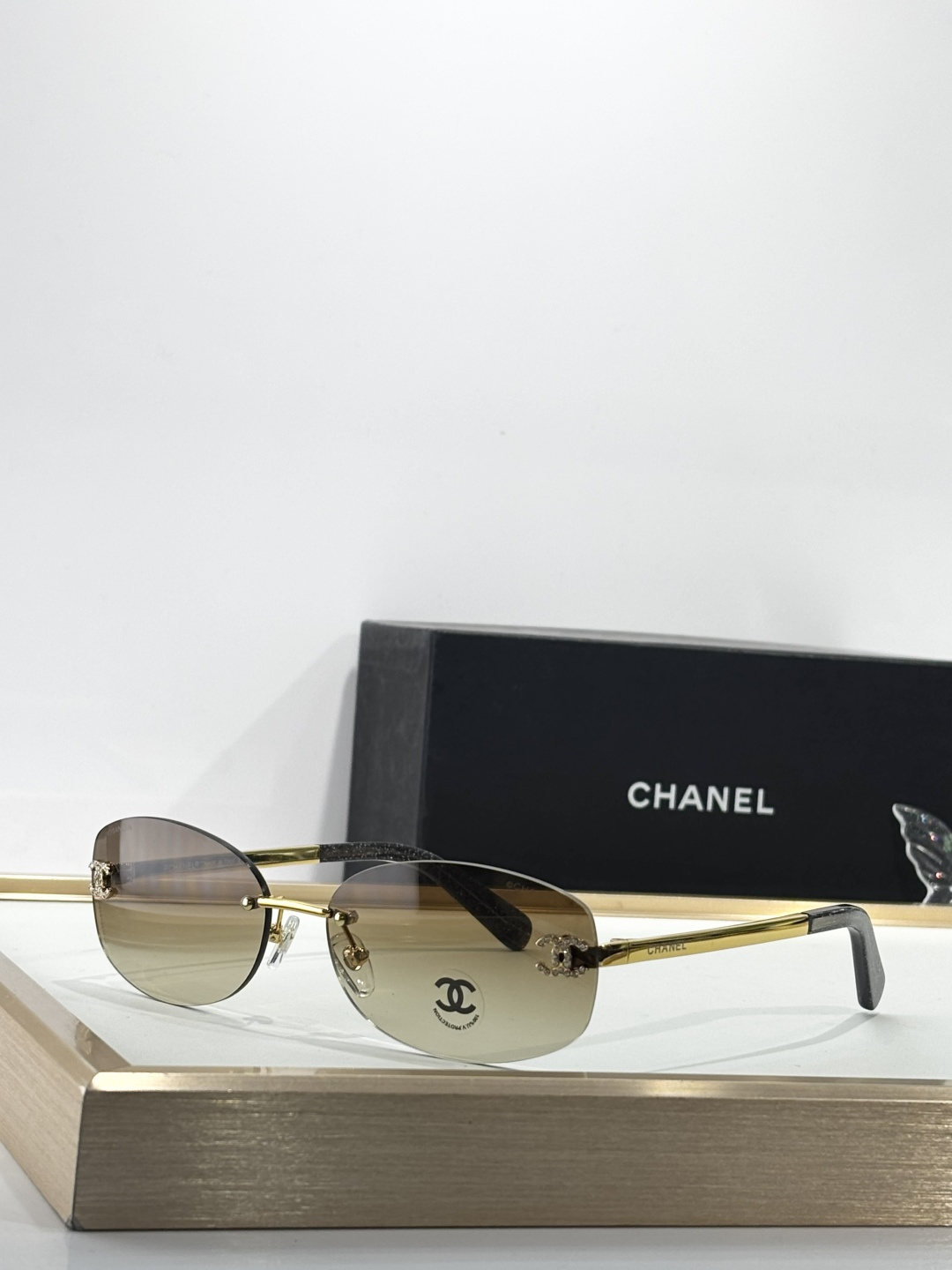 Chanel Rimless Oval Sunglasses with Rhinestone CC Logo