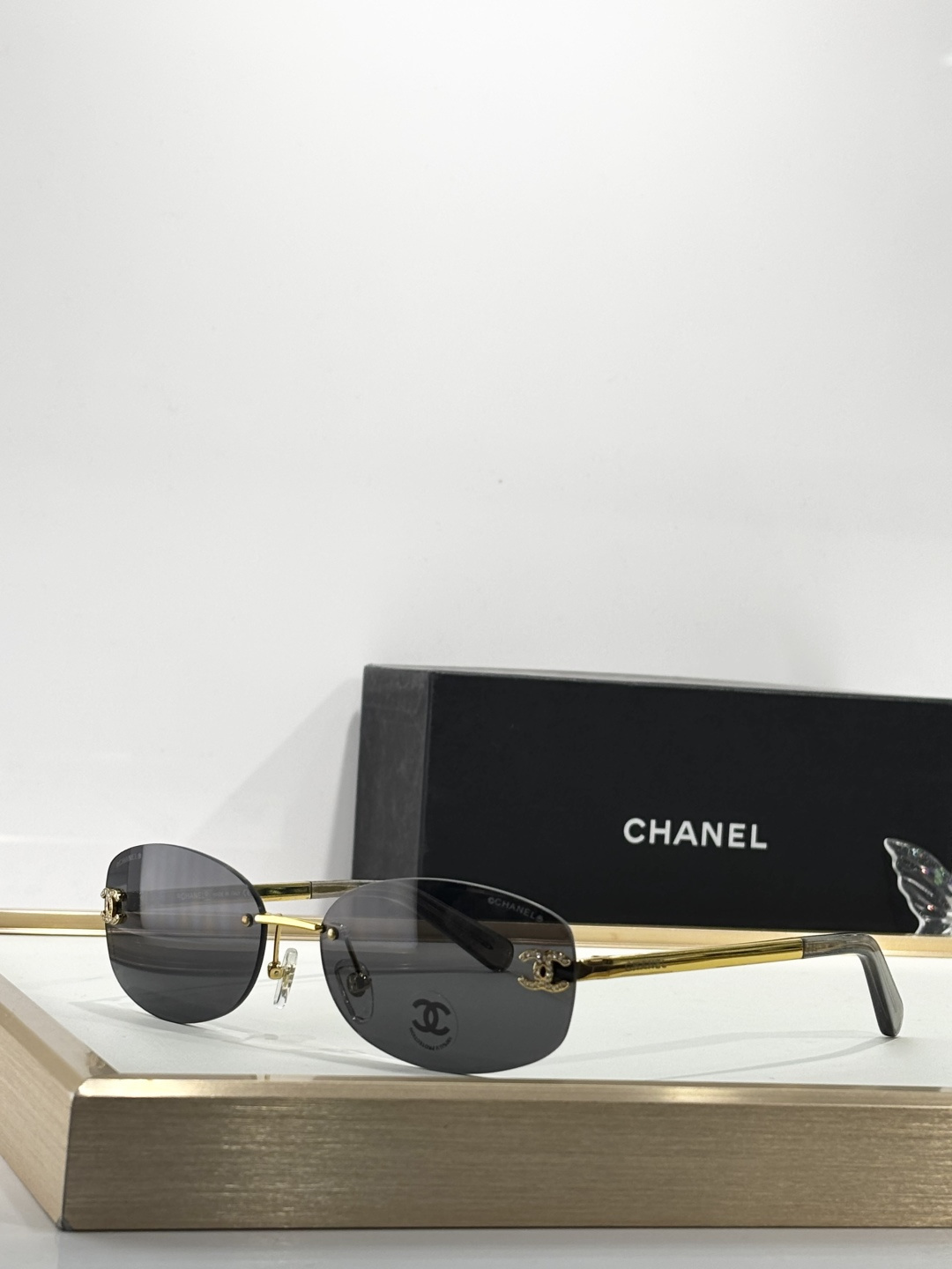 Chanel Rimless Oval Sunglasses with Rhinestone CC Logo