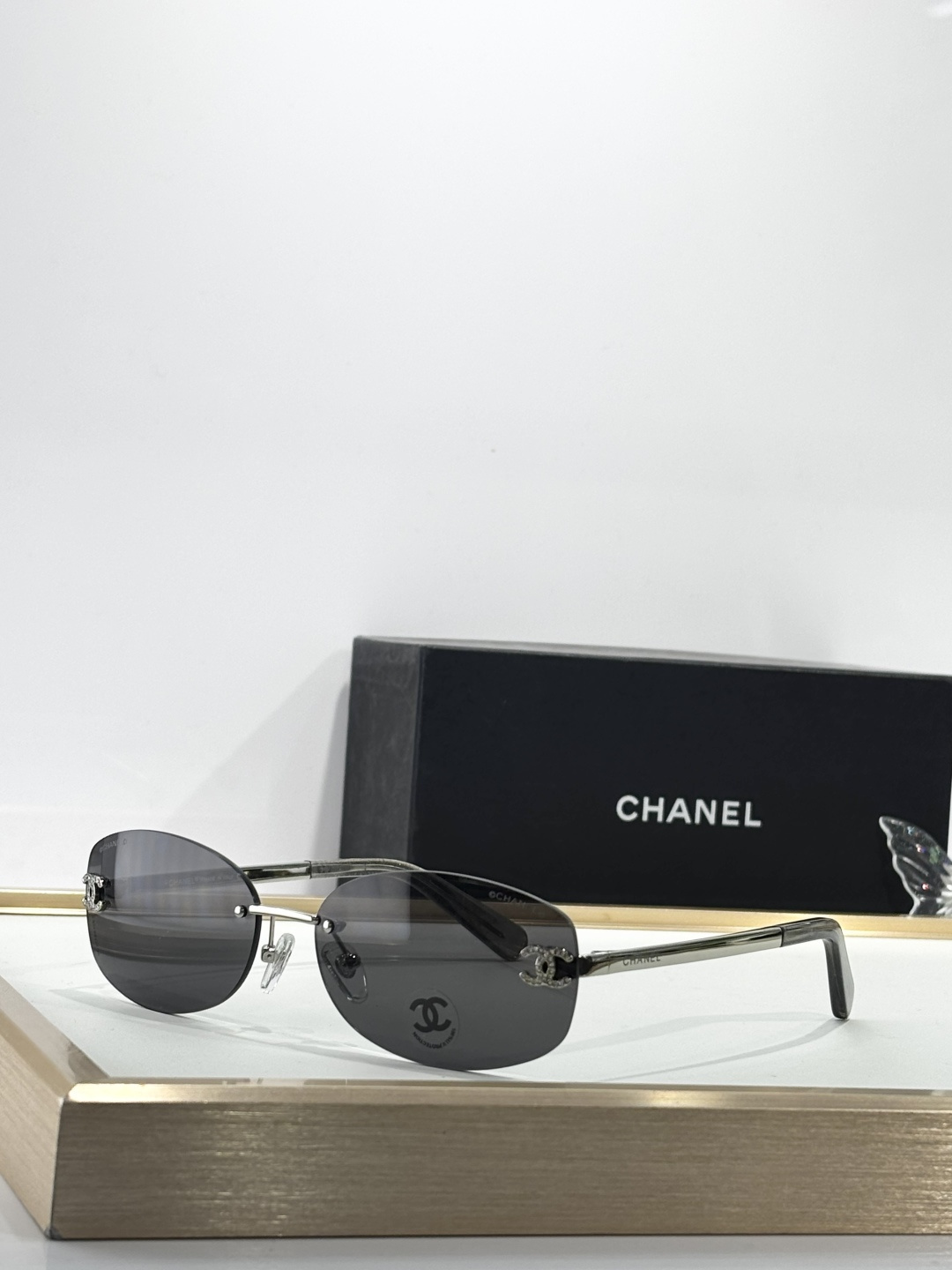 Chanel Rimless Oval Sunglasses with Rhinestone CC Logo