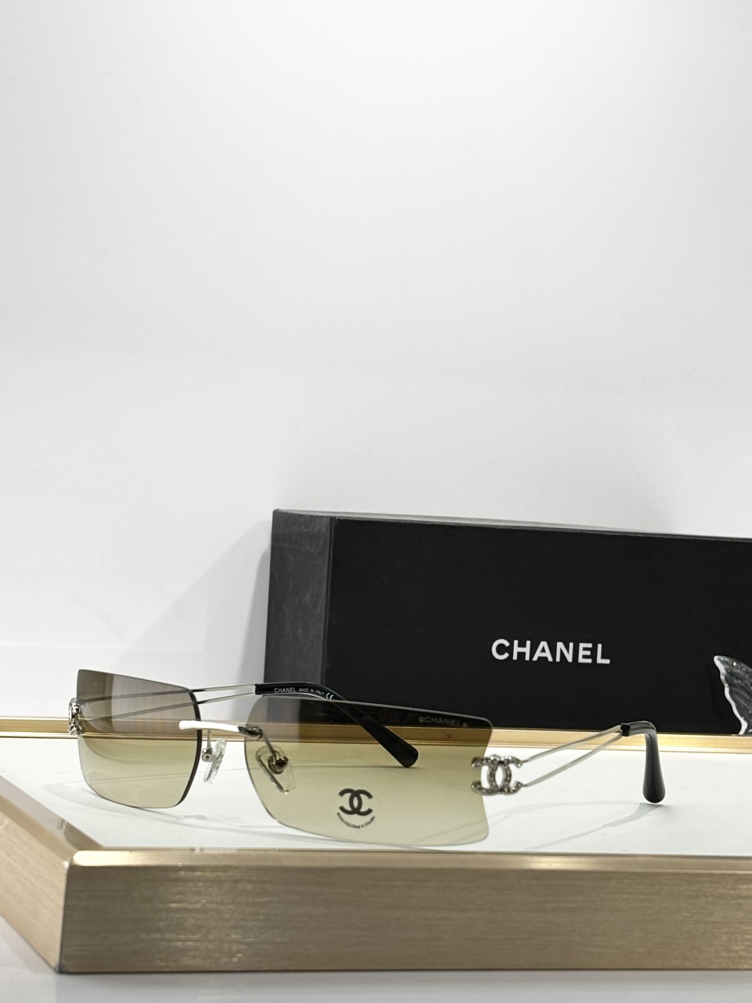Chanel Luxury Rimless Sunglasses with Crystal CC Logo Temples