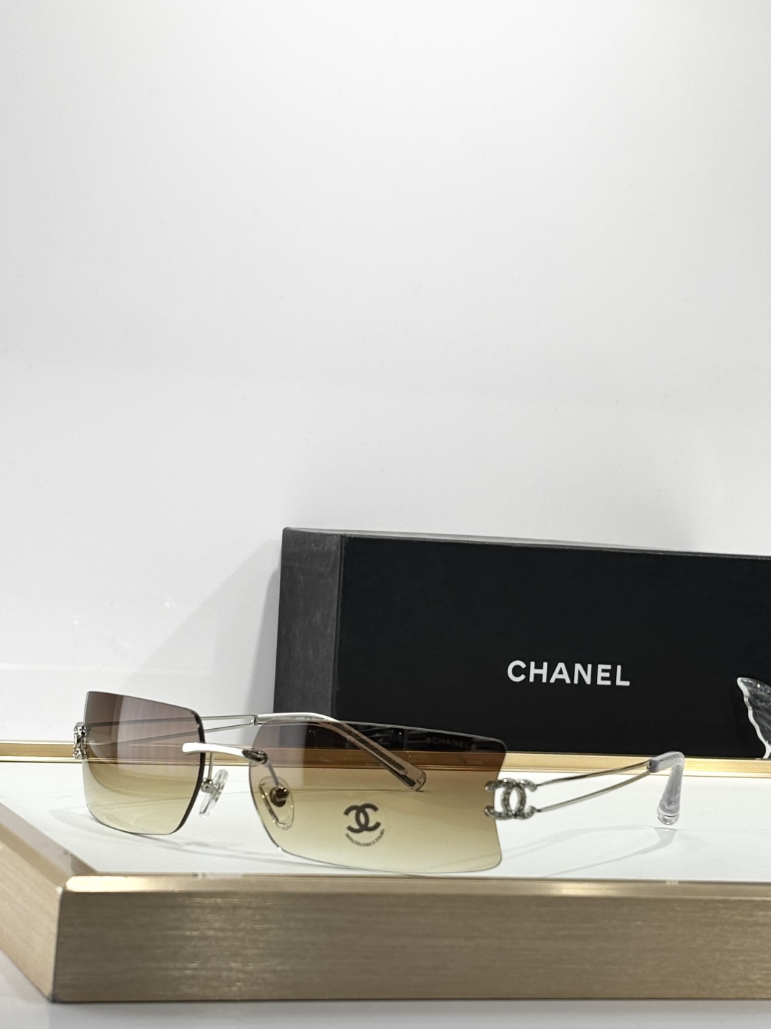 Chanel Luxury Rimless Sunglasses with Crystal CC Logo Temples