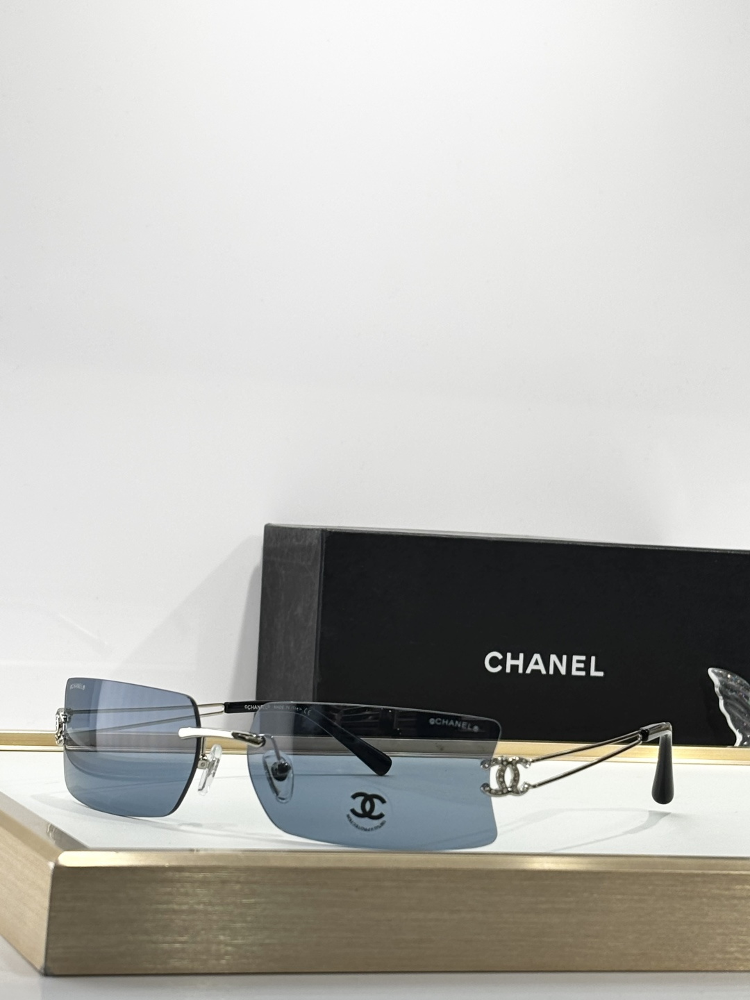 Chanel Luxury Rimless Sunglasses with Crystal CC Logo Temples