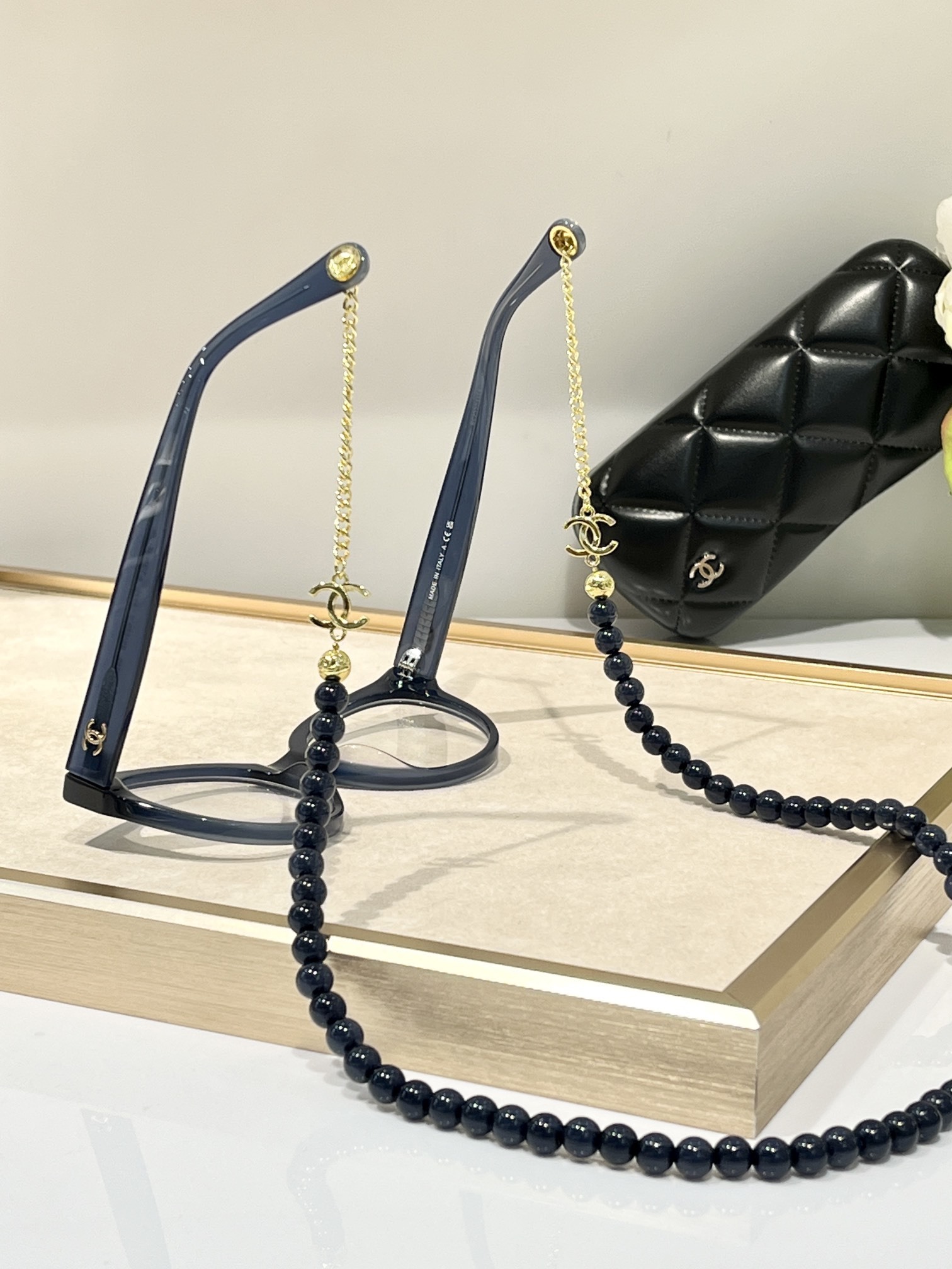 Chanel Luxury Cat-Eye Eyeglasses with Elegant Beaded Chain
