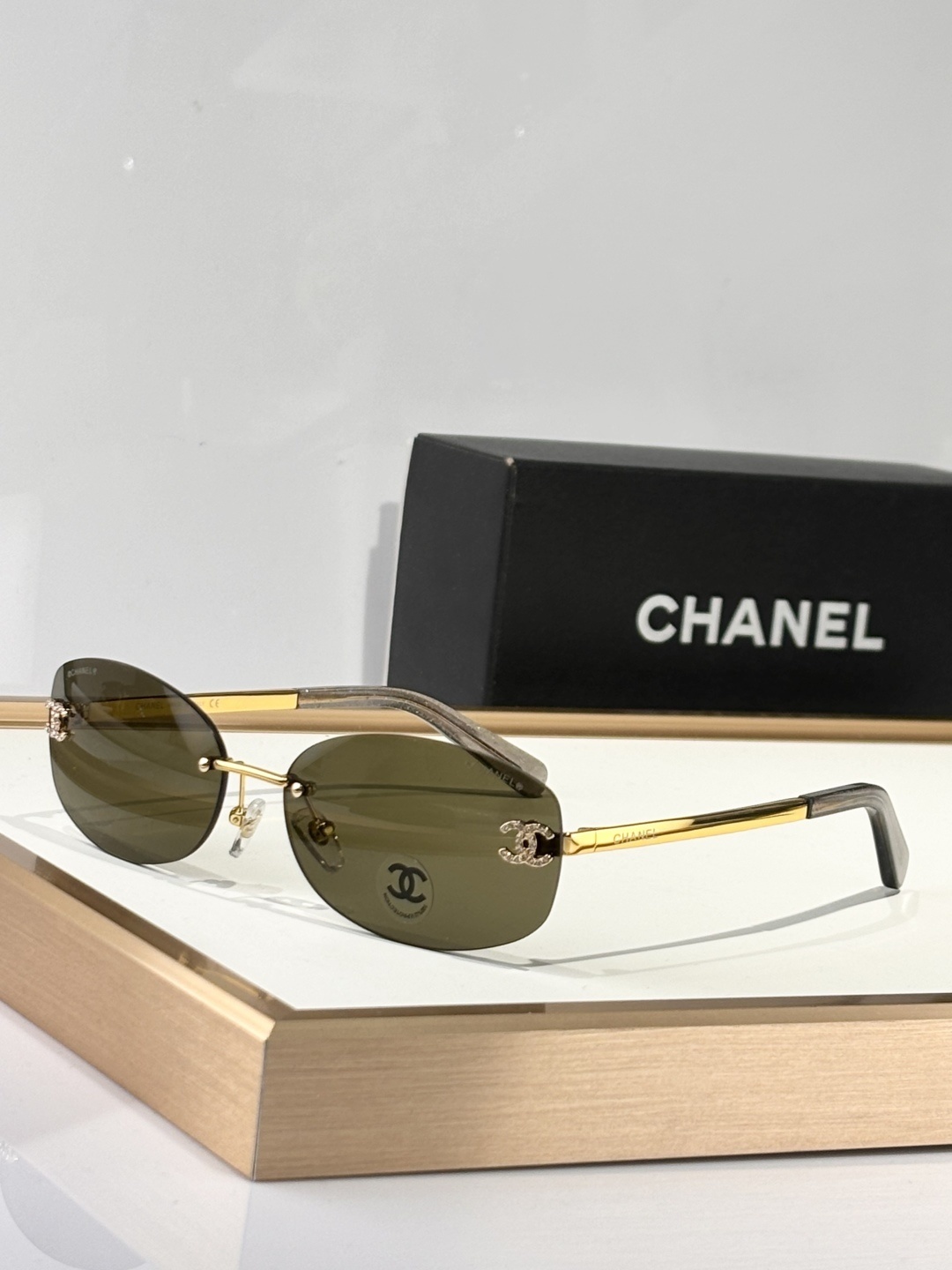 Chanel Luxury Rimless Oval Sunglasses with Rhinestone CC Logo
