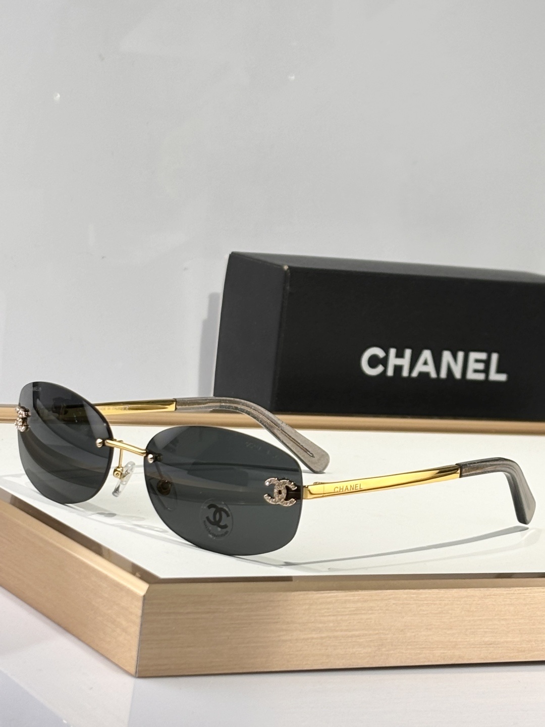 Chanel Luxury Rimless Oval Sunglasses with Rhinestone CC Logo