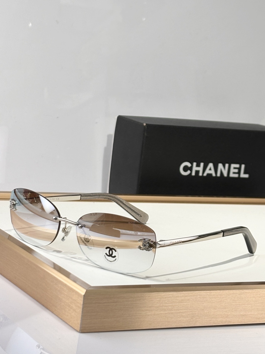 Chanel Luxury Rimless Oval Sunglasses with Rhinestone CC Logo