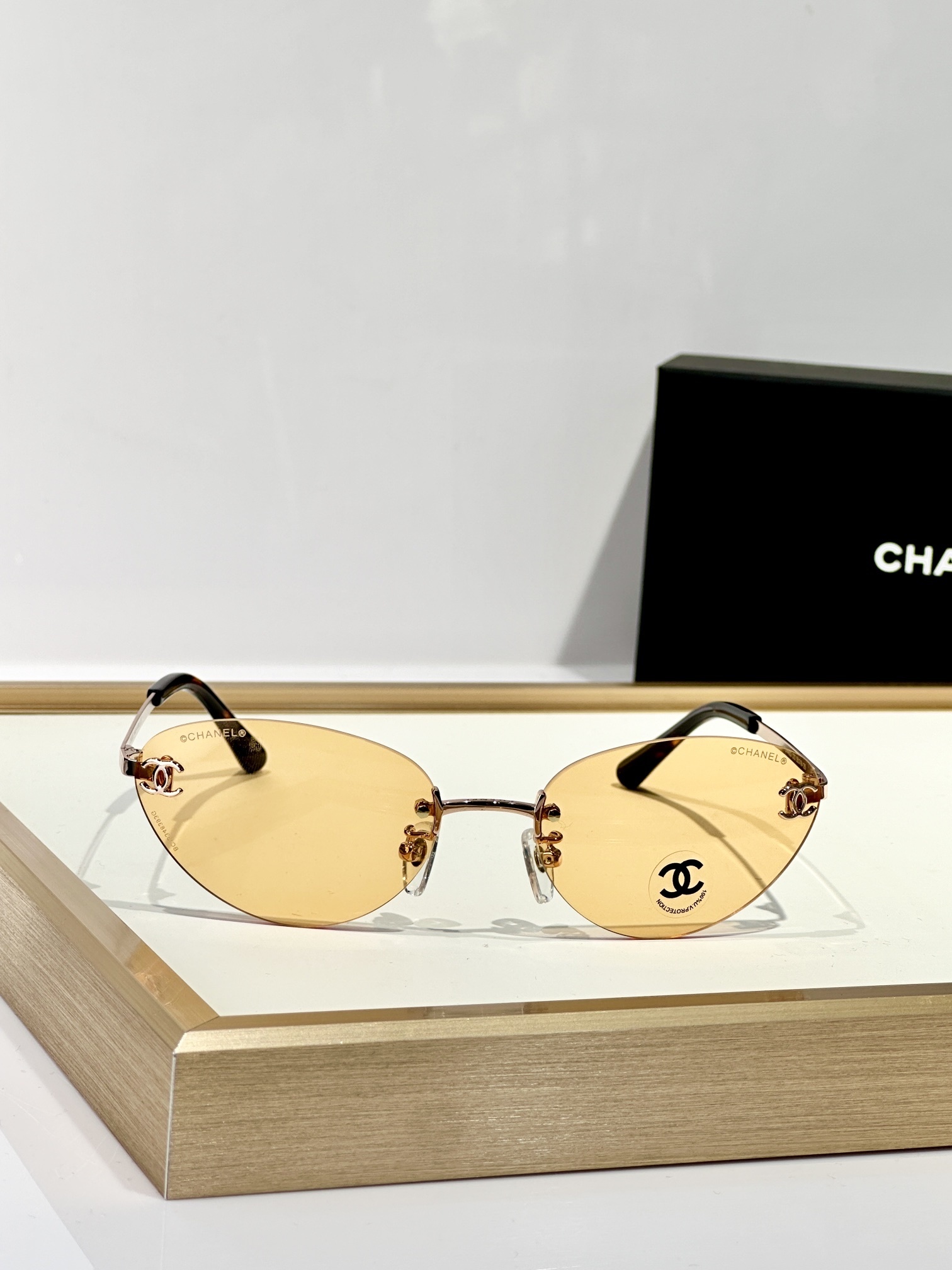 Chanel Rimless Cat-Eye Sunglasses – Gold CC Logo & Tinted Lenses