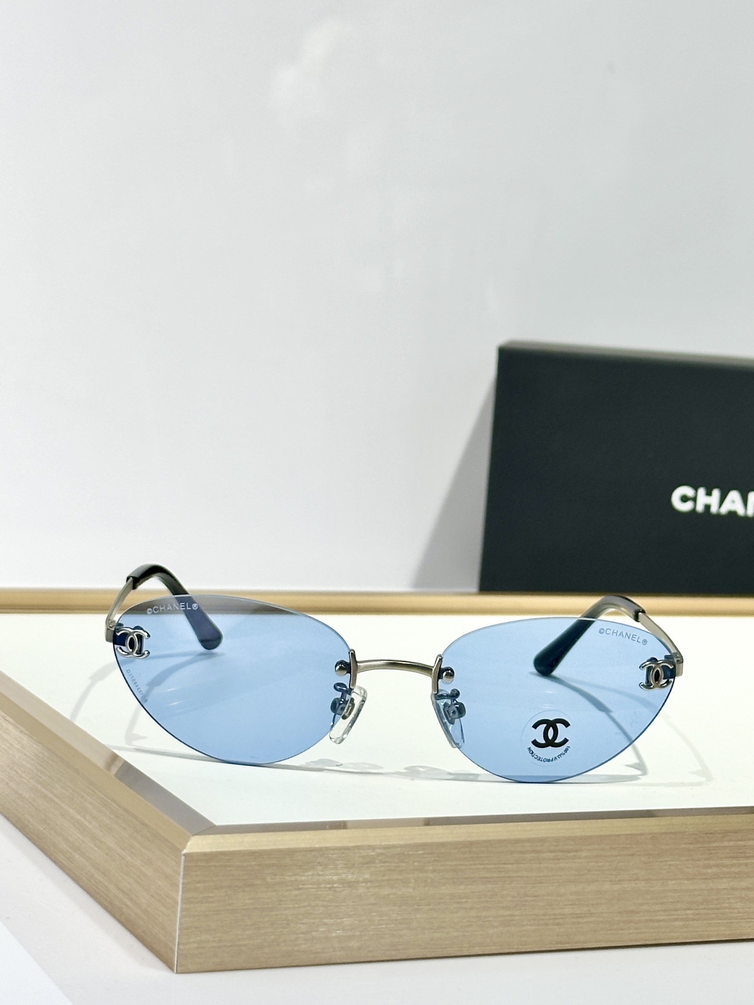 Chanel Rimless Cat-Eye Sunglasses – Gold CC Logo & Tinted Lenses