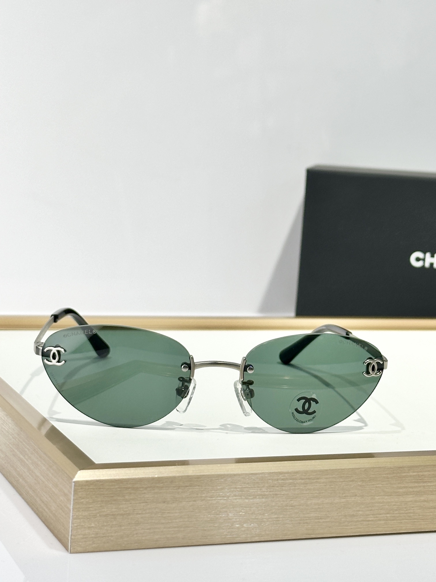 Chanel Rimless Cat-Eye Sunglasses – Gold CC Logo & Tinted Lenses