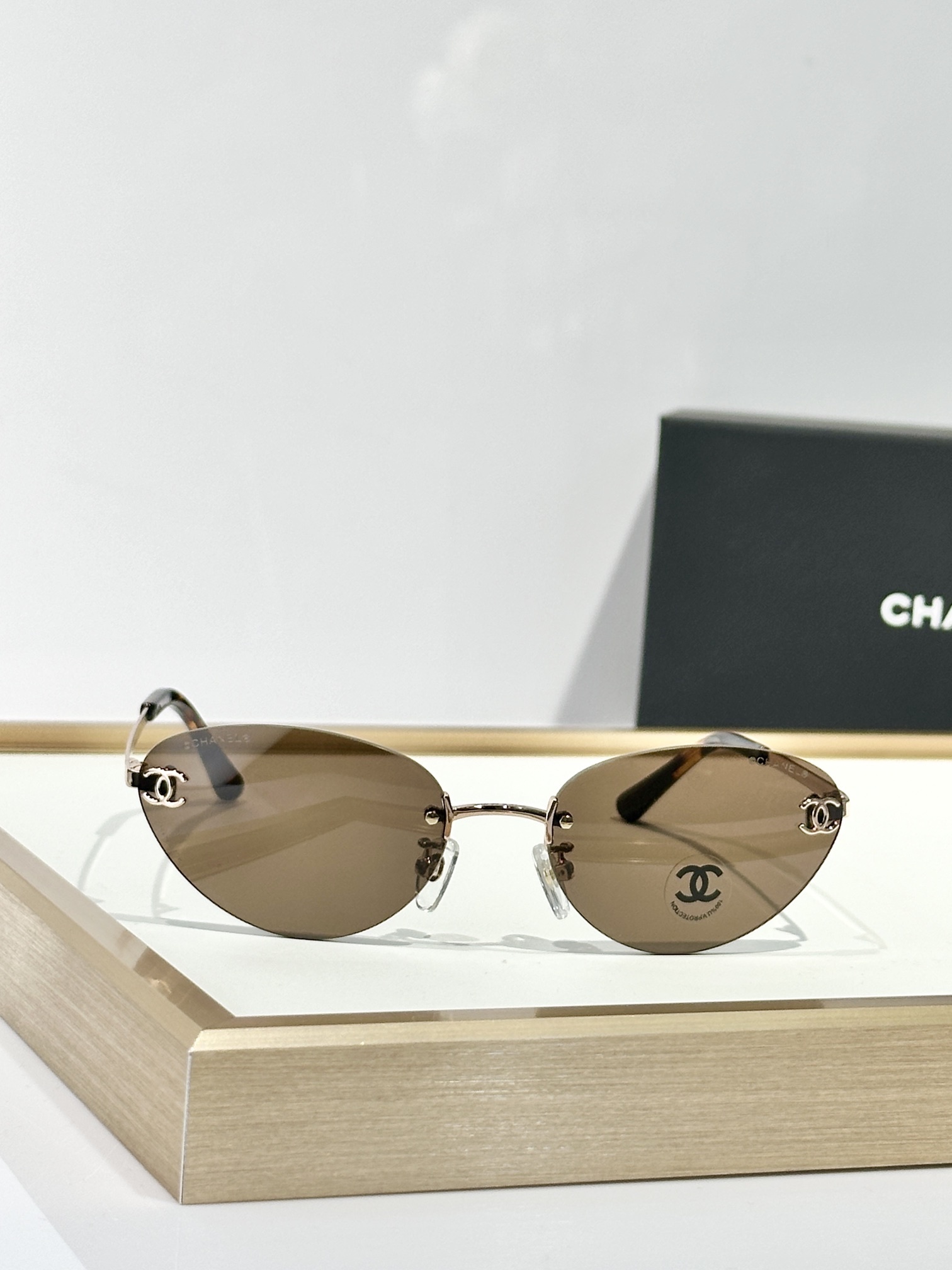 Chanel Rimless Cat-Eye Sunglasses – Gold CC Logo & Tinted Lenses