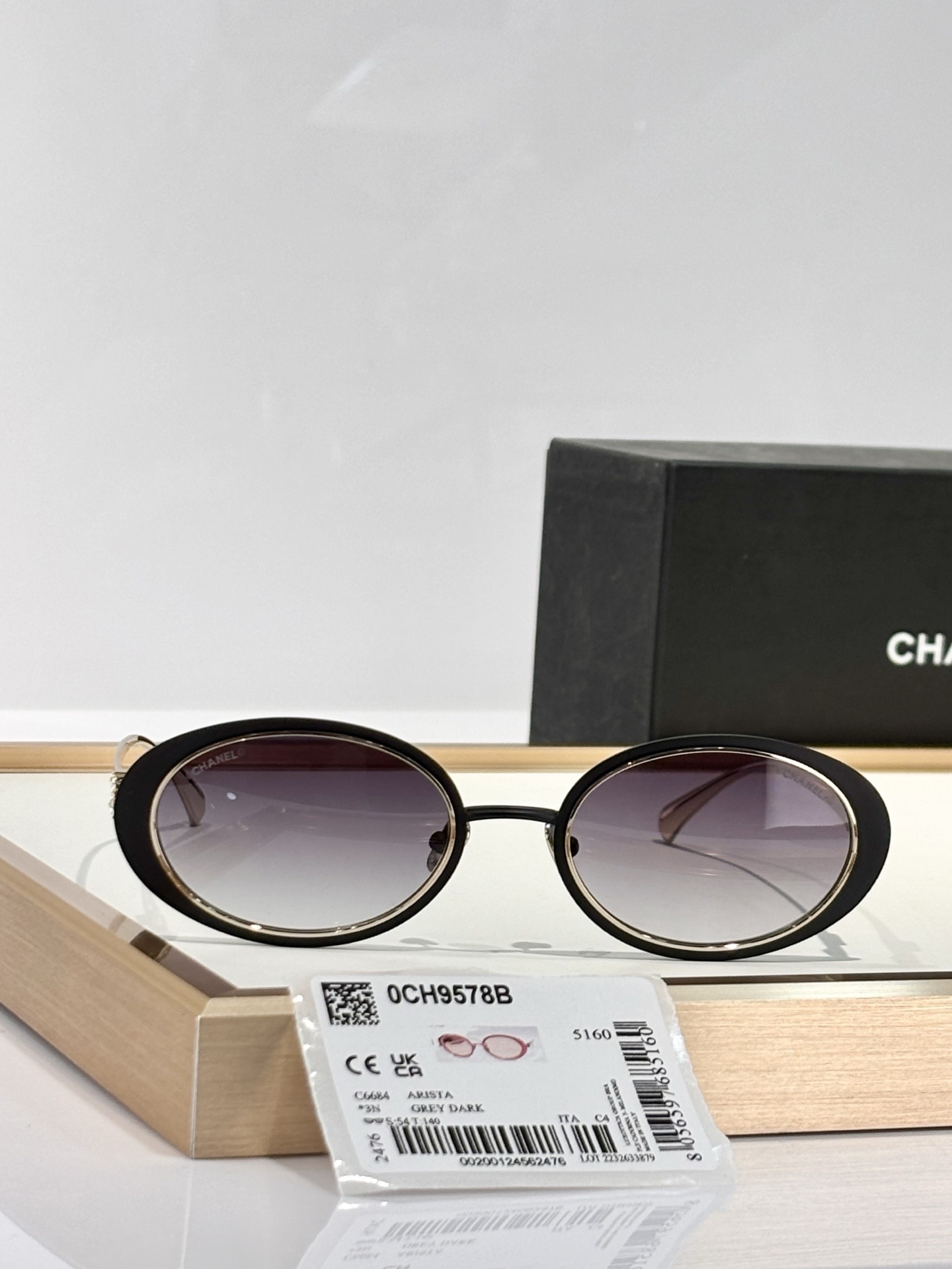 Chanel 0CH9578B Oval Sunglasses – Black & Gold with Crystal CC Logo