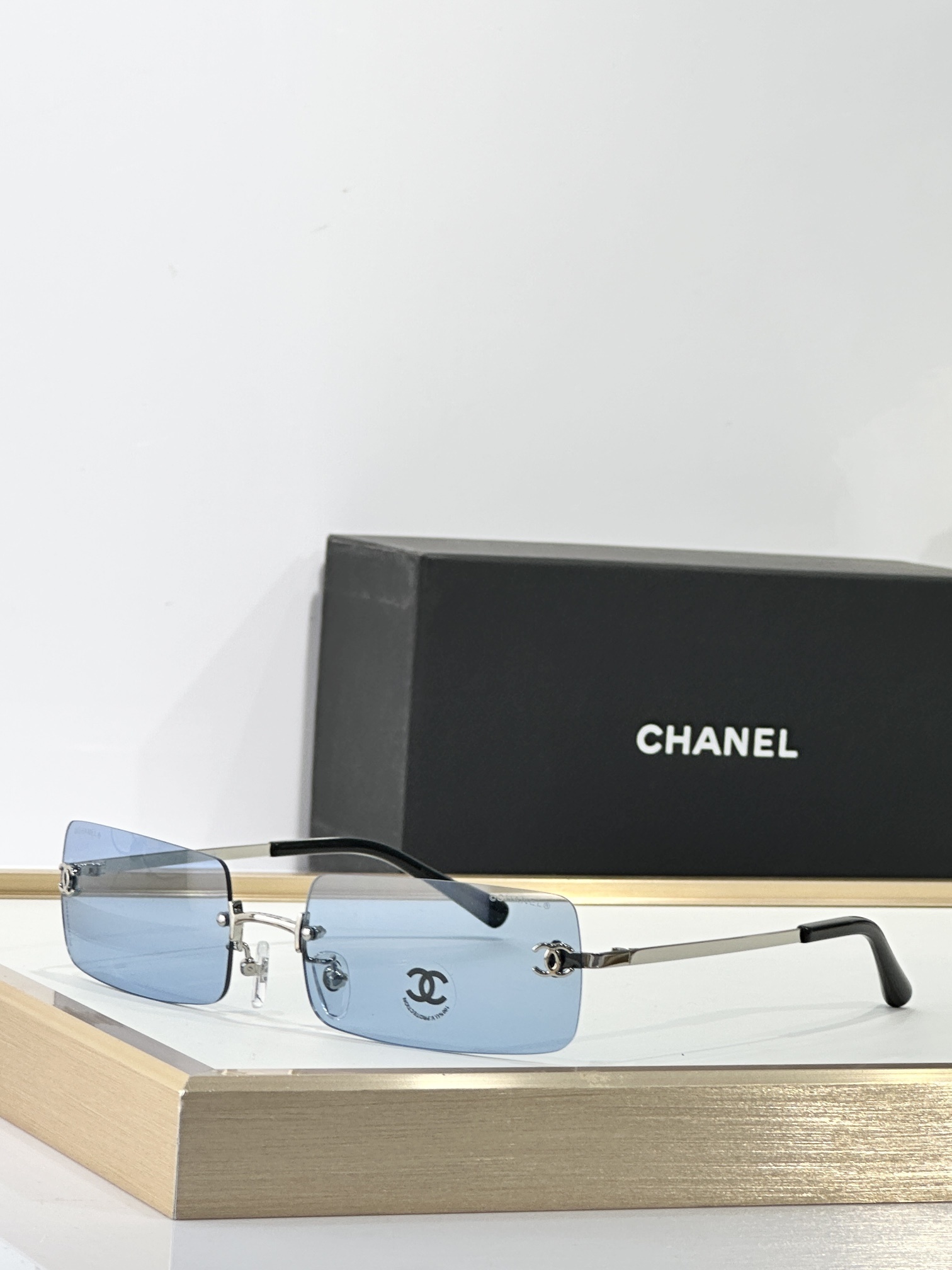 silver Chanel Rimless Blue Tint Sunglasses – Chanel Rimless Blue Tint
