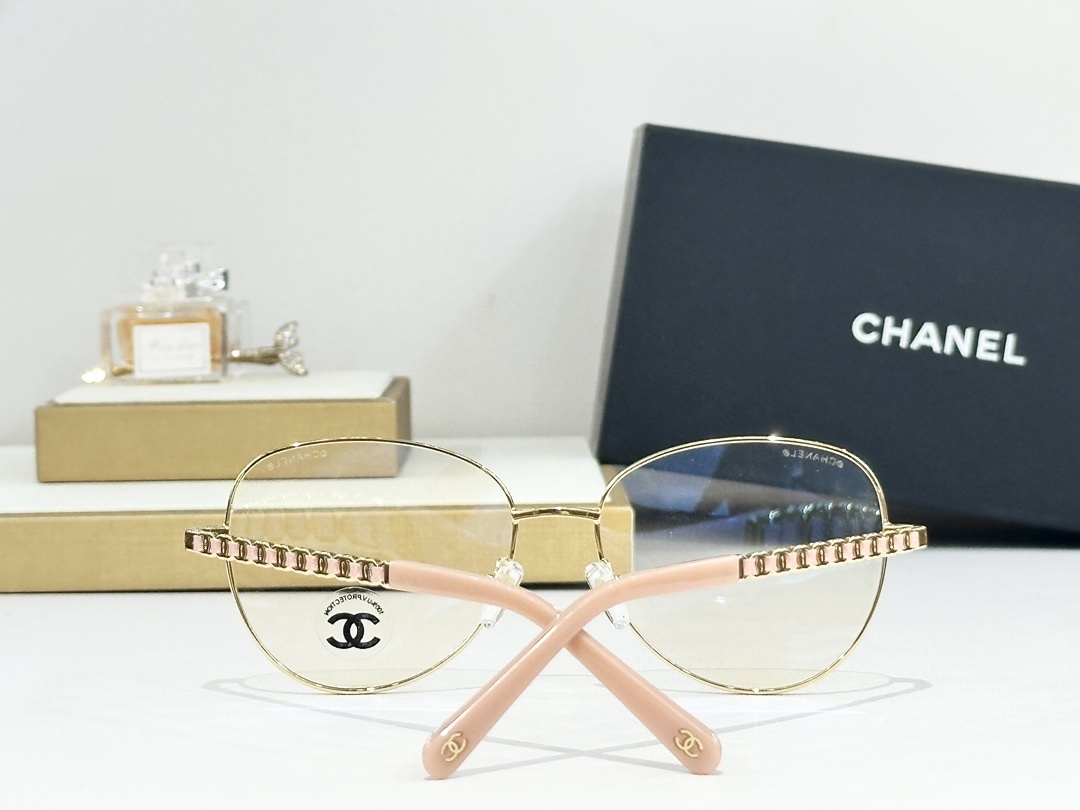 Chanel Women’s Gold Round Eyeglasses with Pink Leather Chain