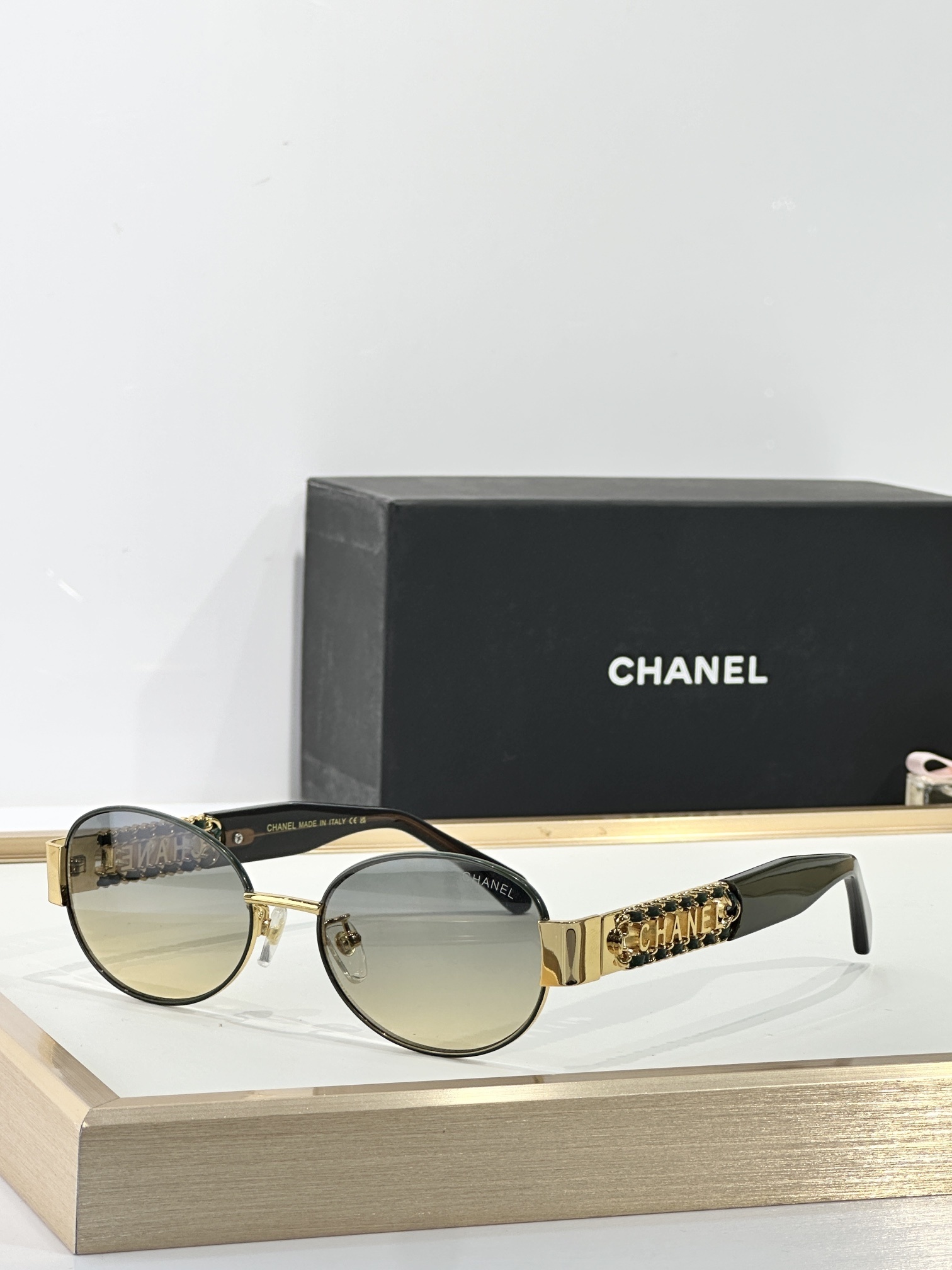 Chanel Gold-Trimmed Oval Sunglasses – Black & Gradient Lenses