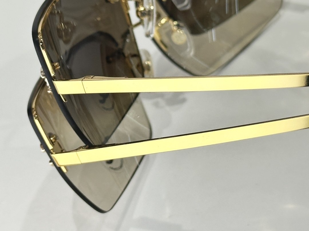 Chanel Luxury Rimless Sunglasses with Crystal CC Logo & Brown Lenses