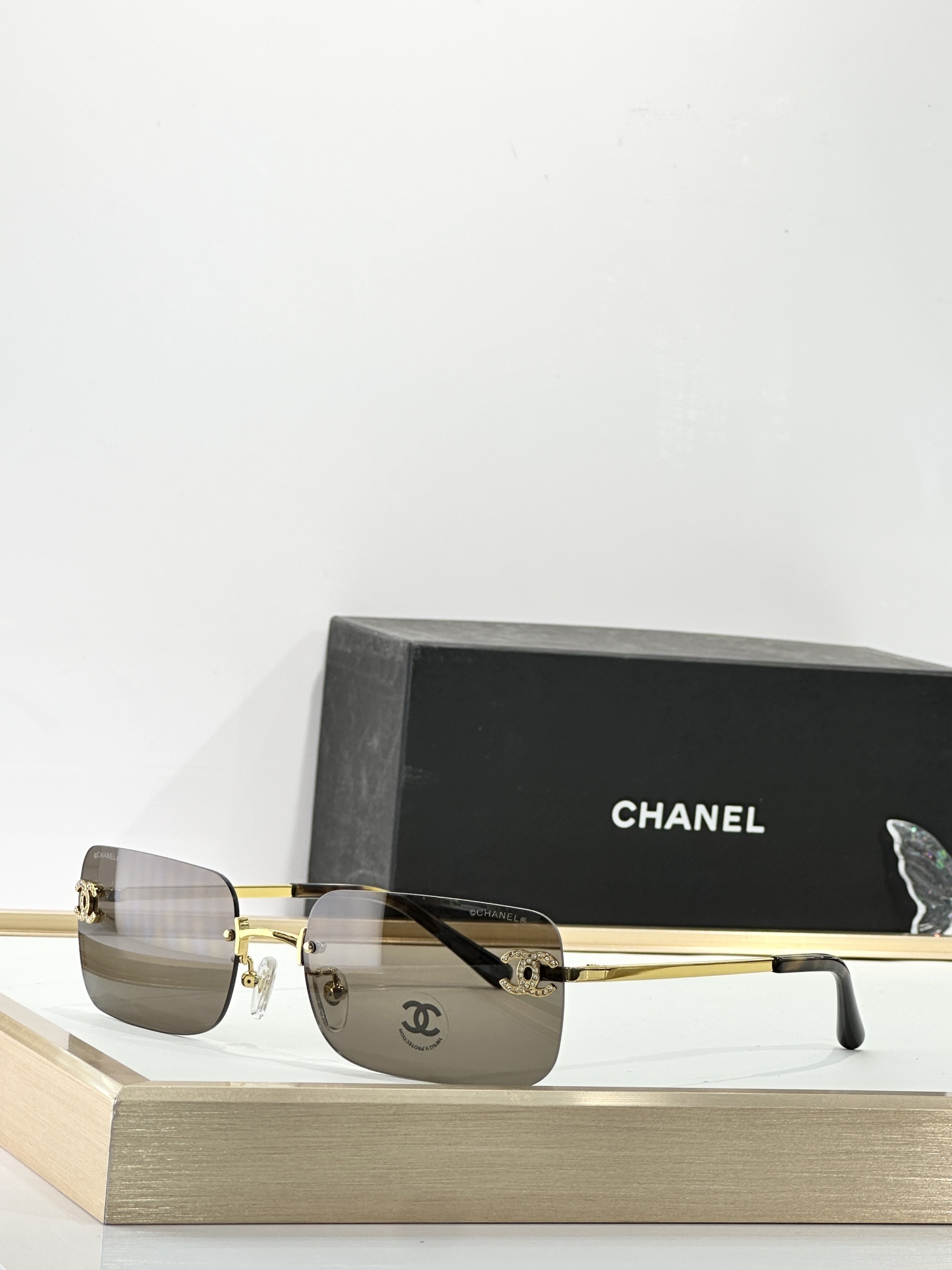 Chanel Luxury Rimless Sunglasses with Rhinestone CC Logo