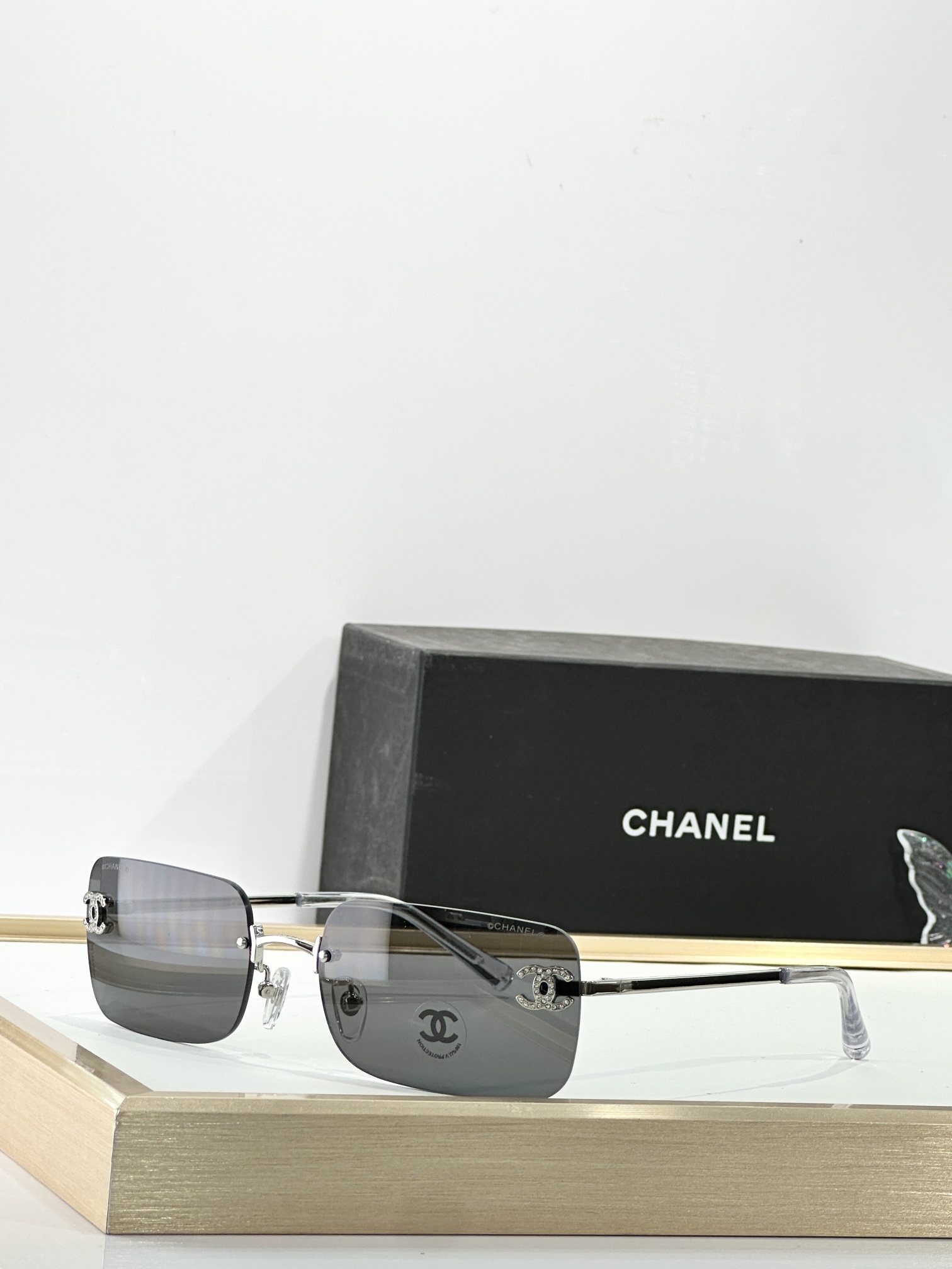 Chanel Luxury Rimless Sunglasses with Rhinestone CC Logo