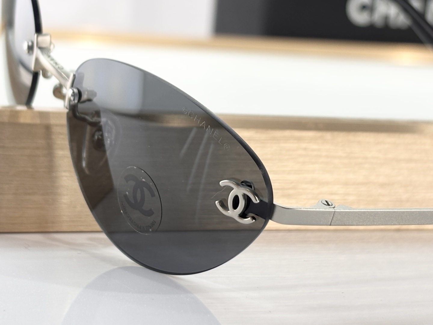 Chanel Luxury Rimless Sunglasses – Blue Tinted Lenses & Silver Logo