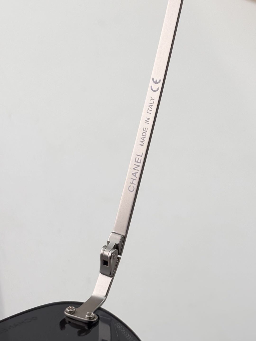 Chanel Luxury Rimless Sunglasses – Blue Tinted Lenses & Silver Logo