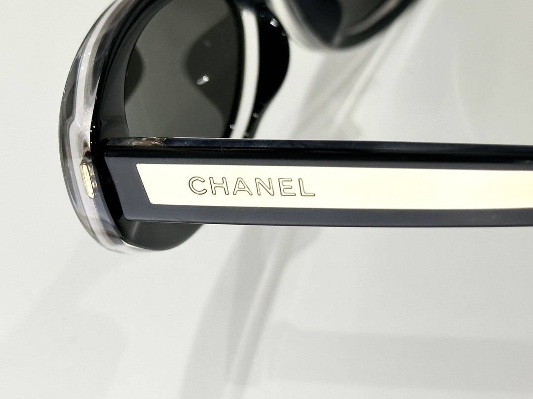 Chanel Luxury Oval Sunglasses – Black & White Vintage Style