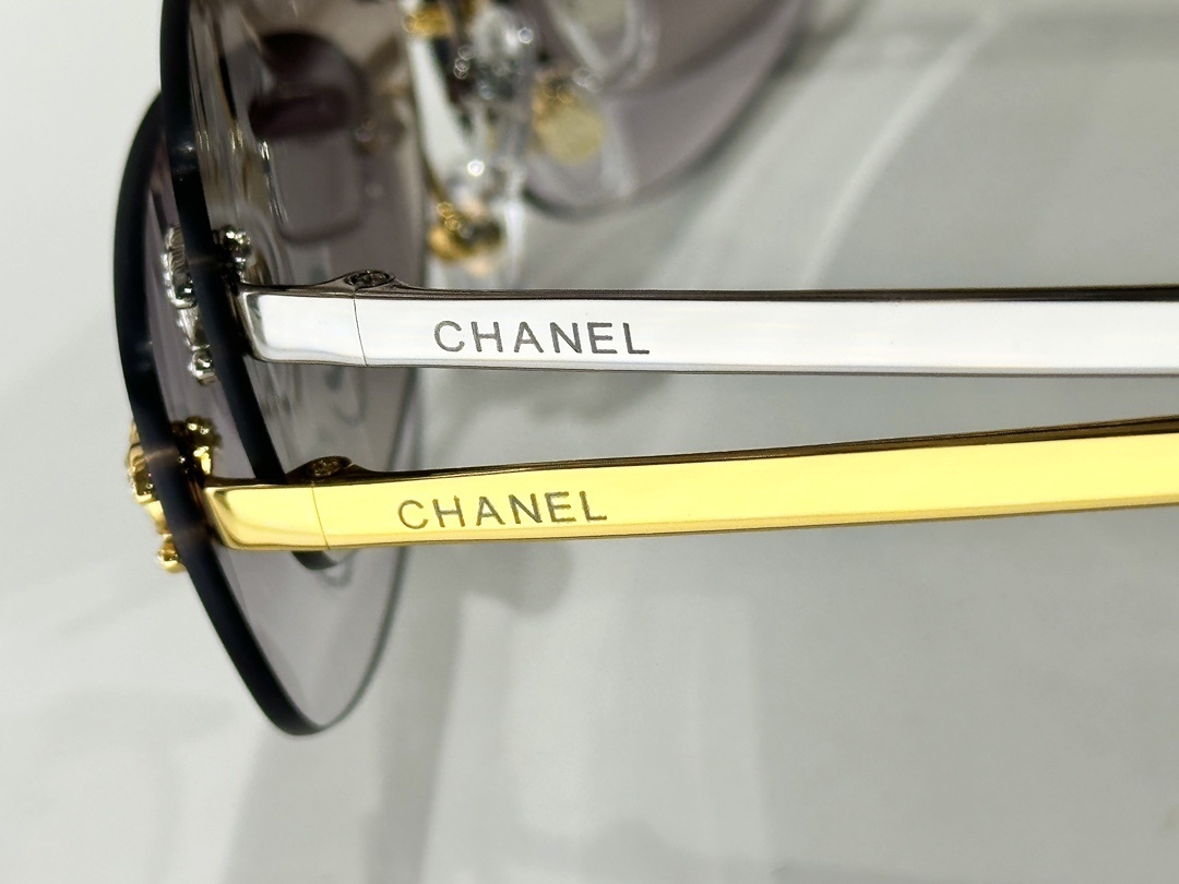 Luxury Rimless Oval Sunglasses with Rhinestone Logo for Women