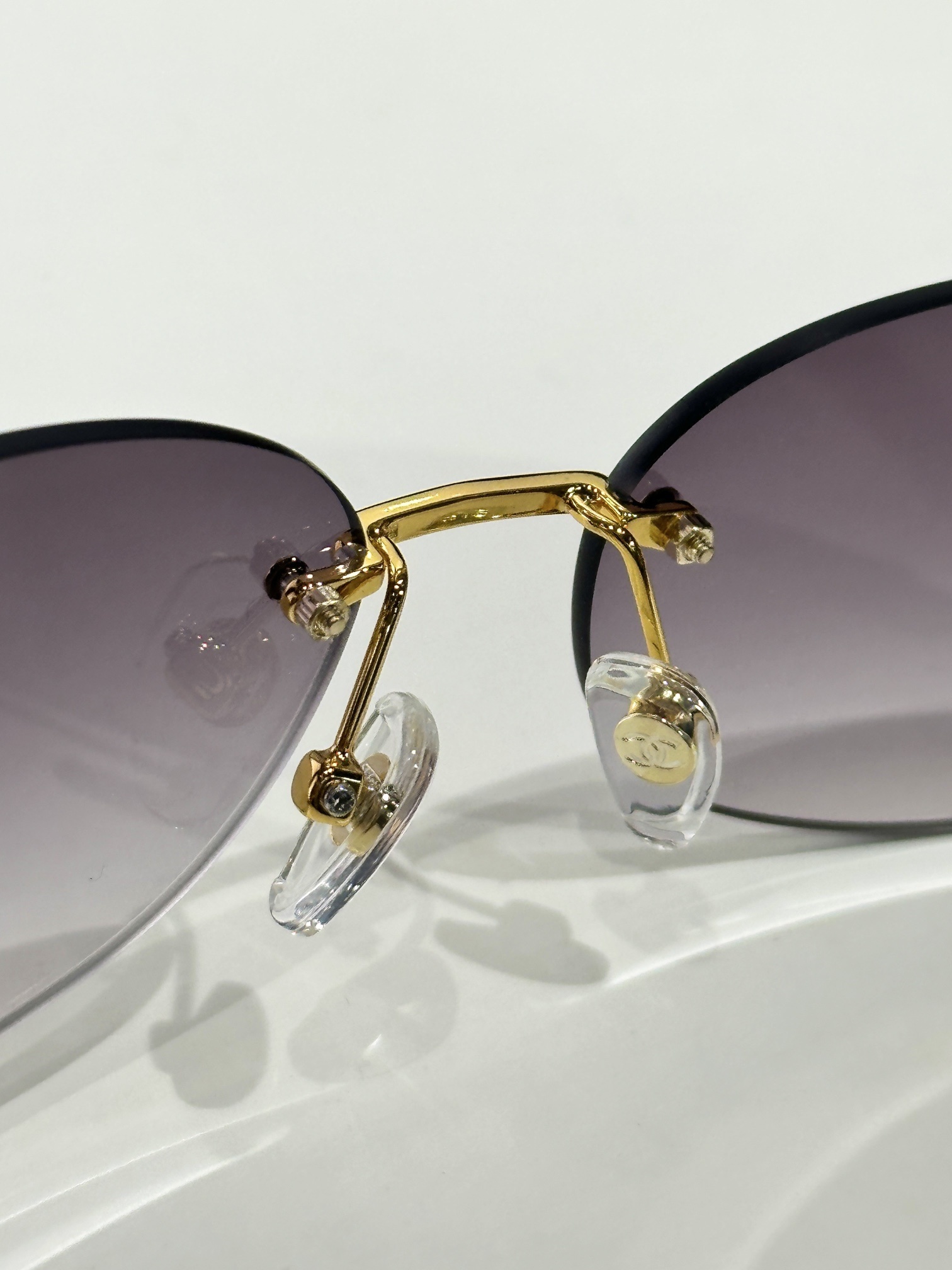 Luxury Rimless Oval Sunglasses with Rhinestone Logo for Women