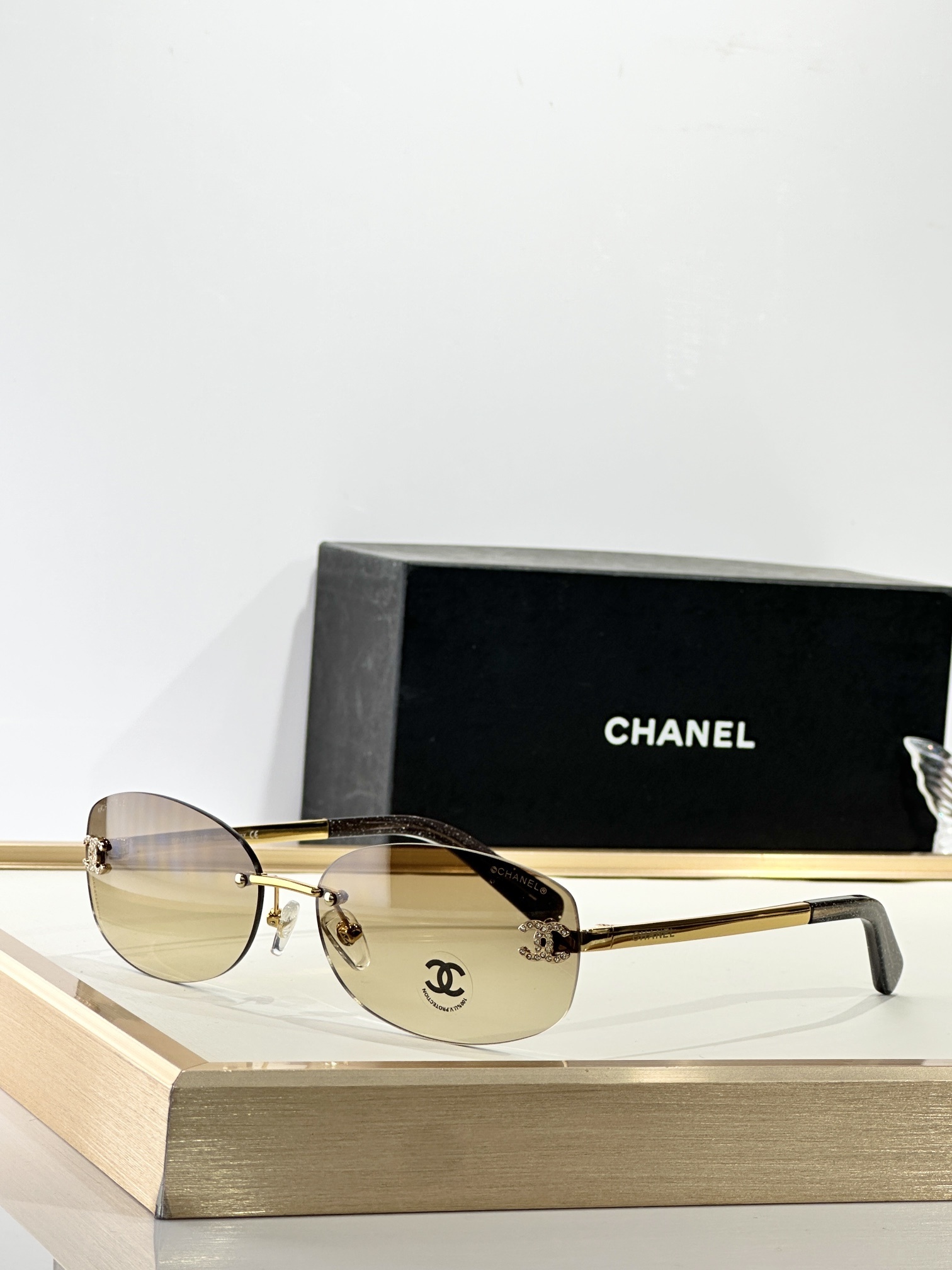Chanel Rimless Oval Sunglasses with Rhinestone CC Logo – Brown