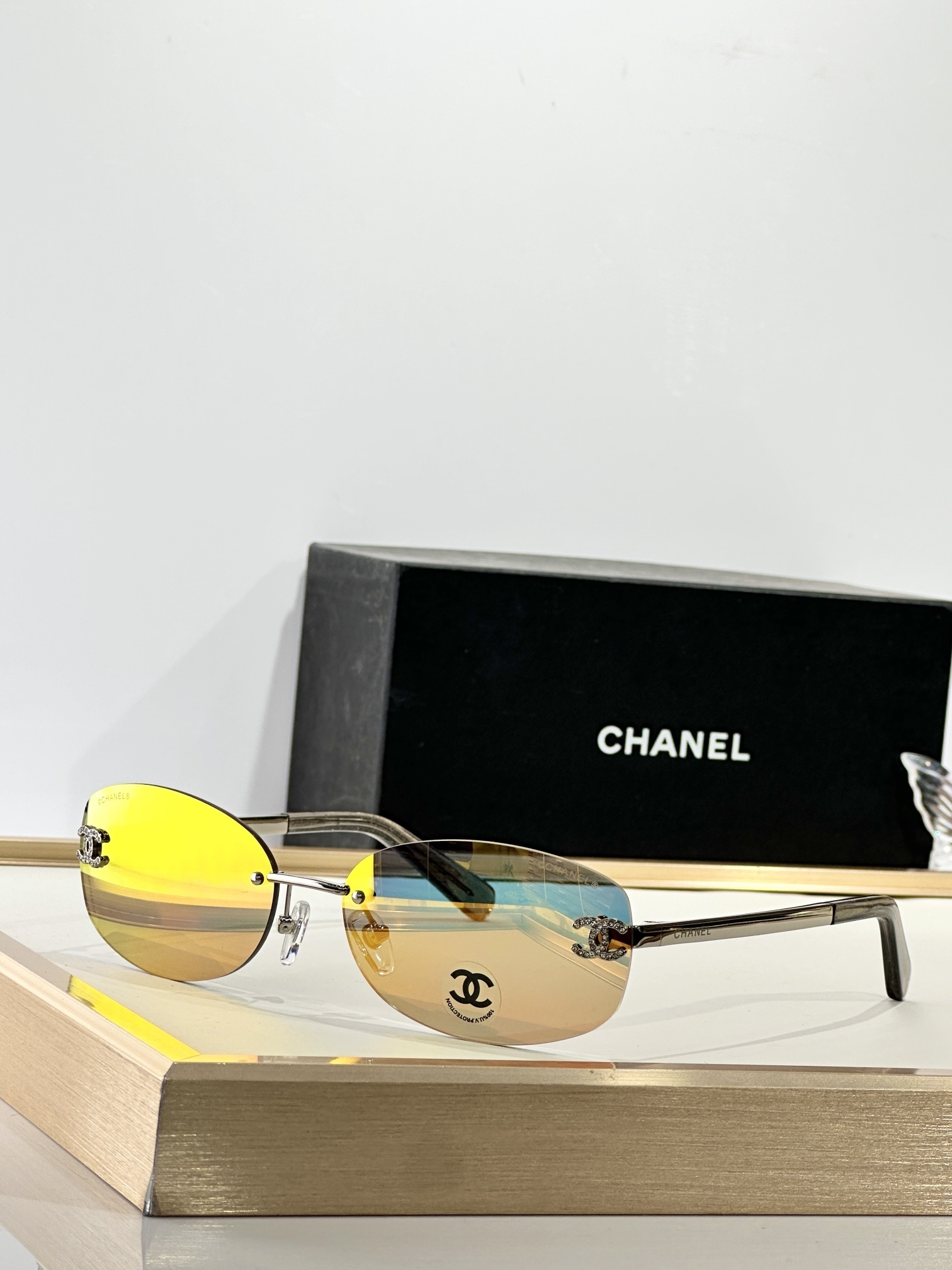 Chanel Rimless Oval Sunglasses with Rhinestone CC Logo – Brown