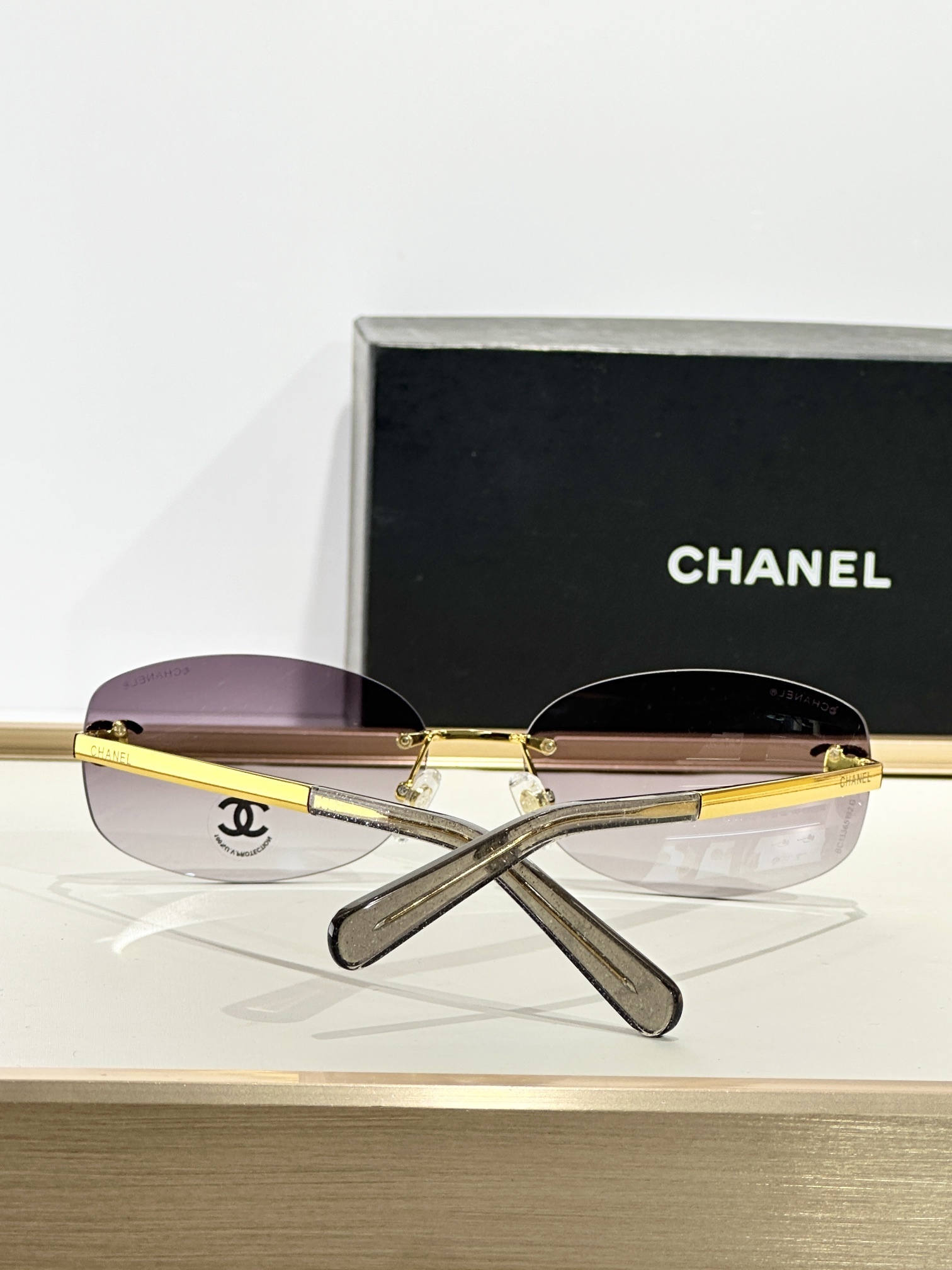 Chanel Rimless Oval Sunglasses with Rhinestone CC Logo – Brown
