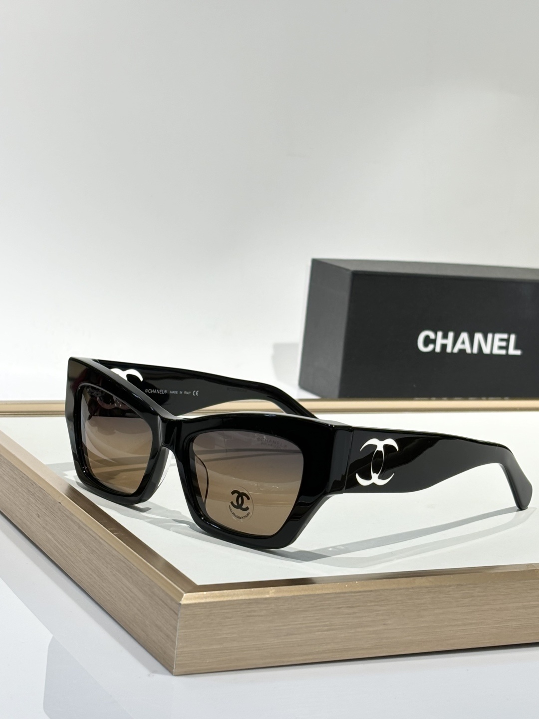 Chanel Luxury Square Sunglasses with Iconic White Cut-out Logo