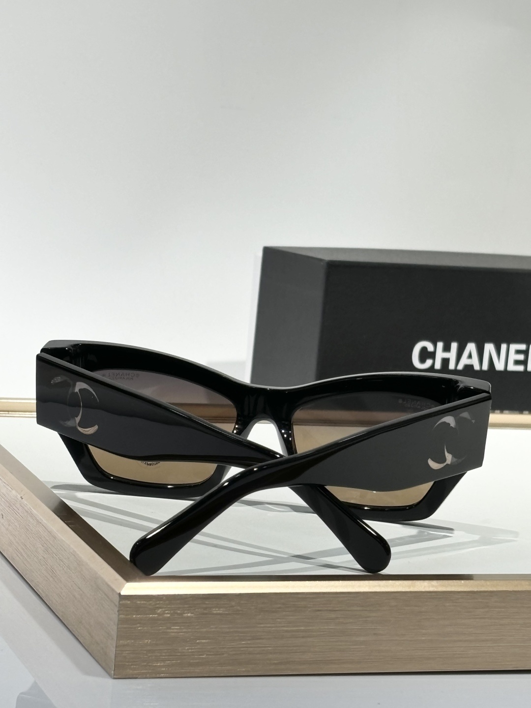 Chanel Luxury Square Sunglasses with Iconic White Cut-out Logo
